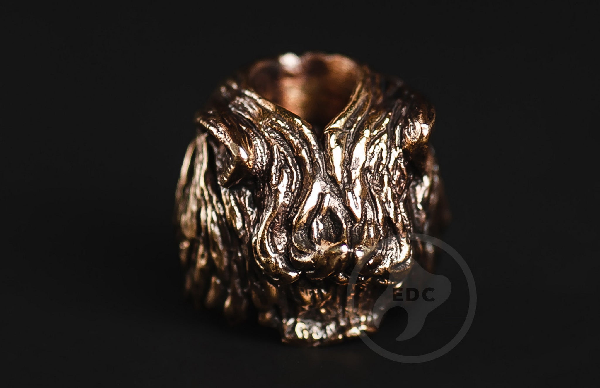 Profile view of the wild wolf head brass bead showing the 5mm lanyard hole.-1