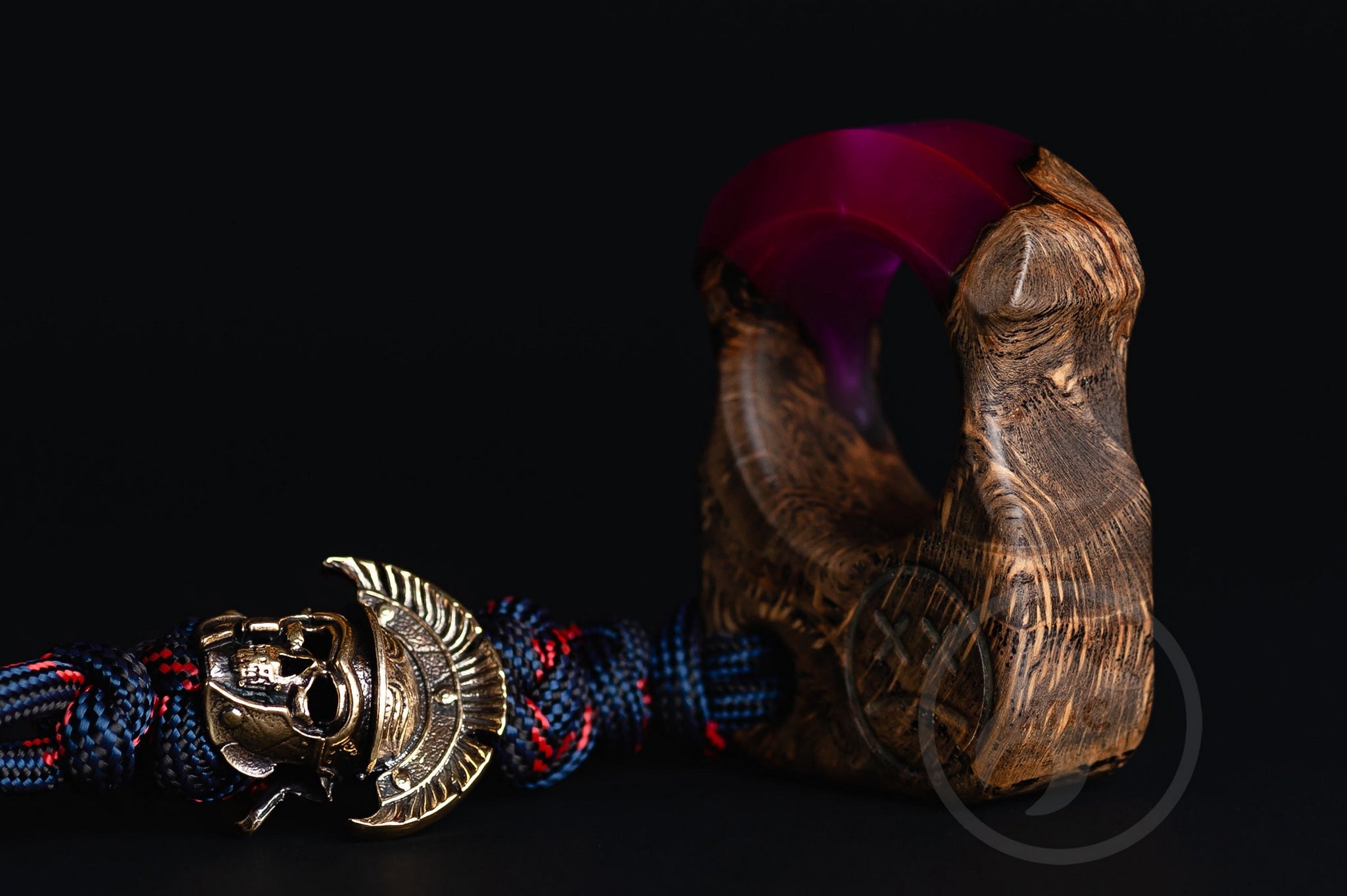 Close up of solid brass Roman Centurion helmet bead on purple lanyard, Texture detail of purple resin and oak wood pocket art-3