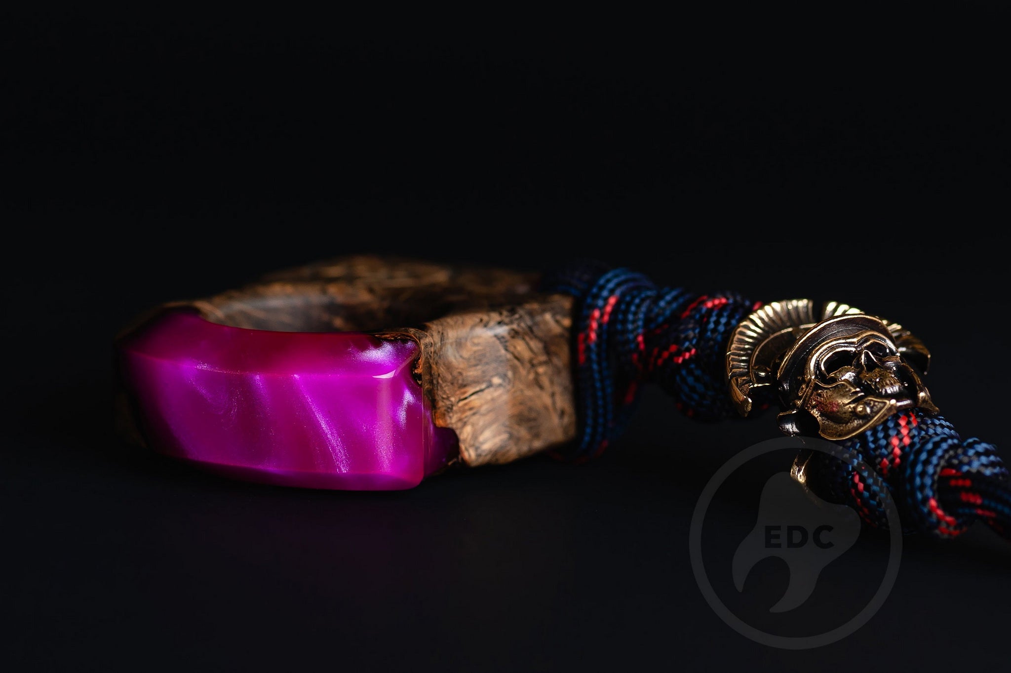 Close up of solid brass Roman Centurion helmet bead on purple lanyard, Texture detail of purple resin and oak wood pocket art-4