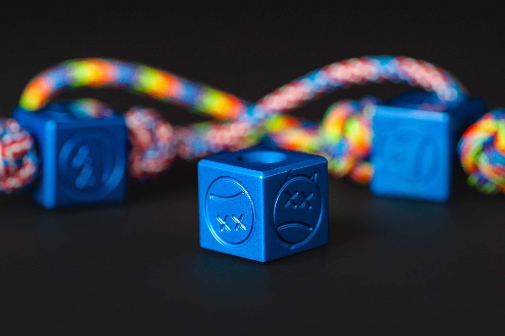 Close-up of the vibrant Type II blue anodized texture on a metal bead.