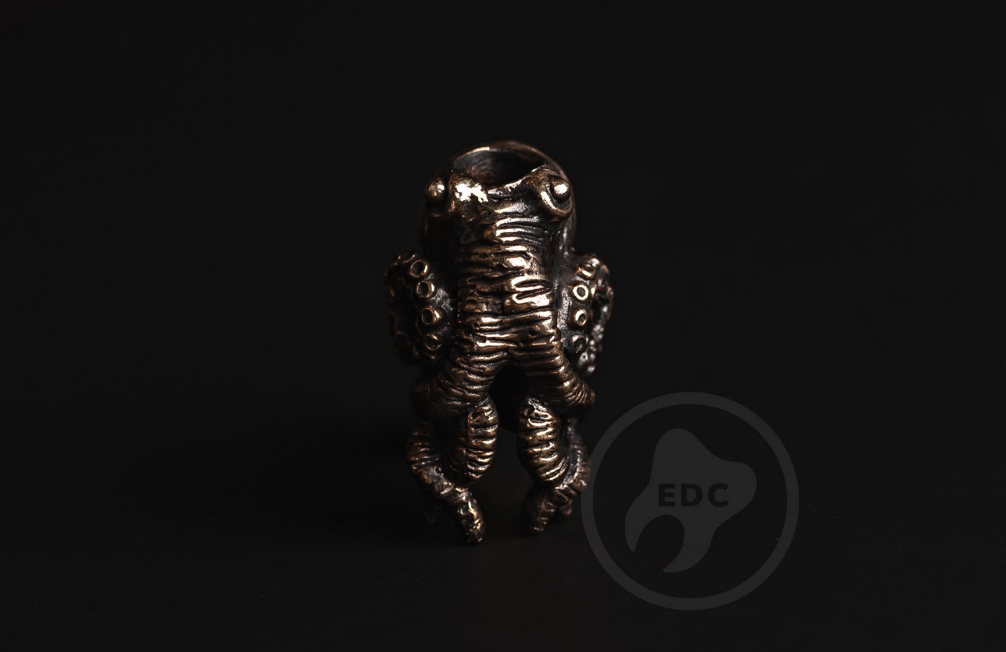 Profile of the nautical octopus bead showing the antique finish and 5mm hole.-3