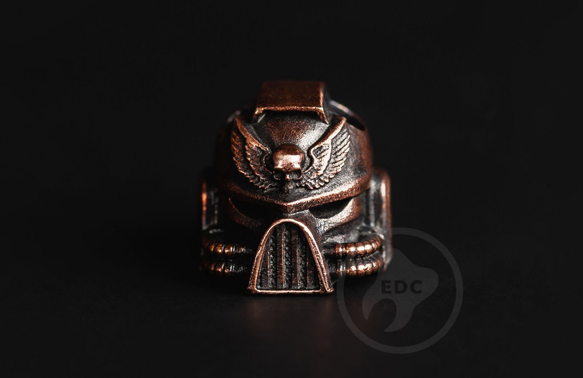 Hand-casted brass lanyard bead shaped like a Grimdark Space Marine power armor helmet.-1