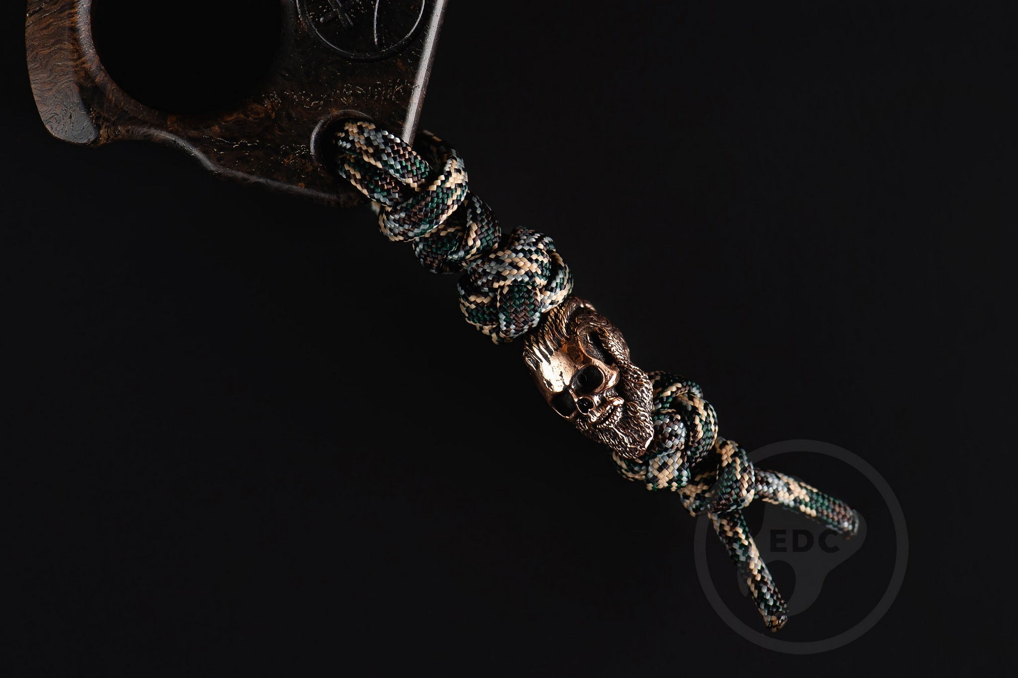 Close up of solid brass Viking King Ragnar bead on lanyard, Texture detail of natural oak burl pocket art-5