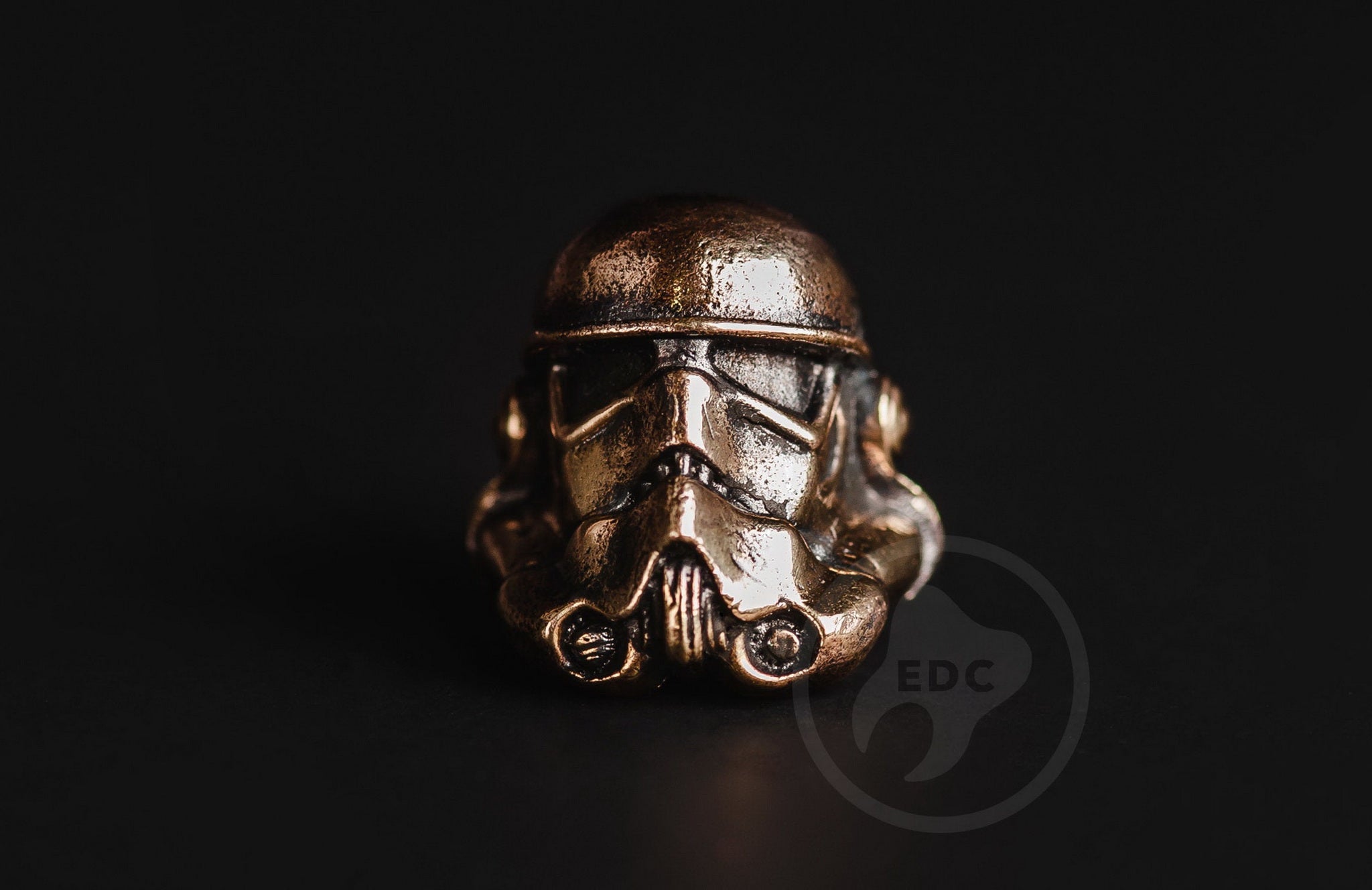 Hand-casted brass lanyard bead in the shape of an Imperial Galactic Soldier helmet.-1