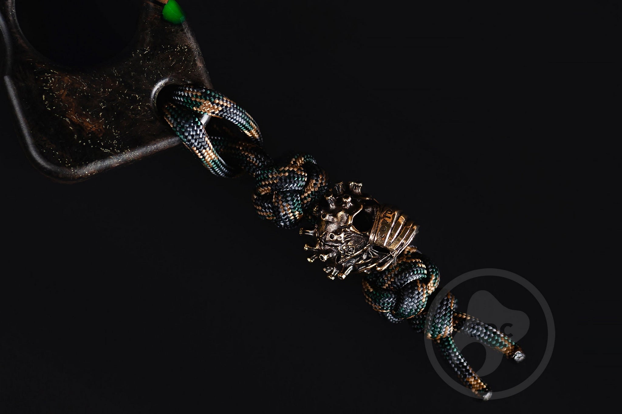 Close up of solid brass Covid-19 bead on green lanyard, Texture detail of oak burl and green resin pocket sculpture-4