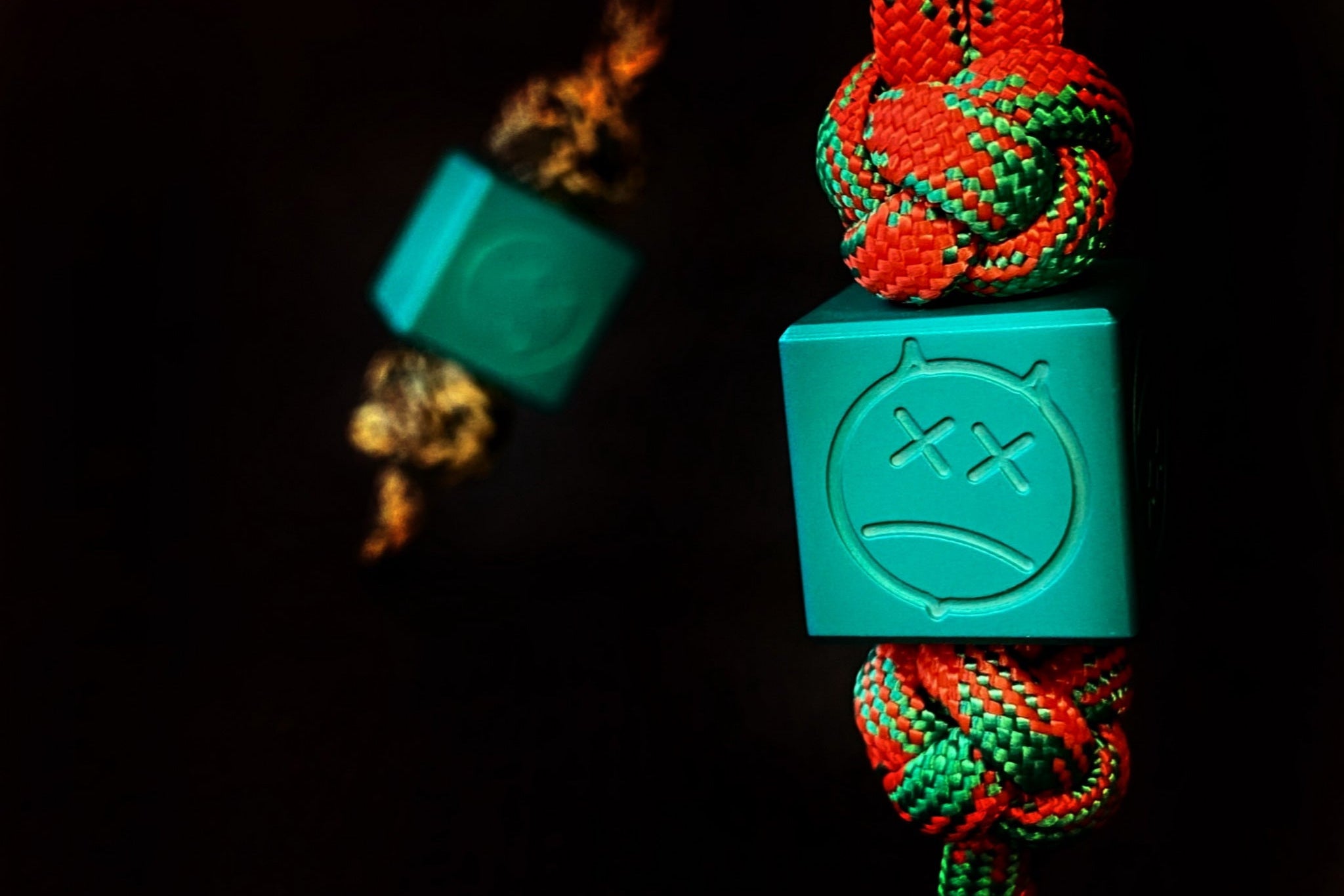 Sandblasted matte teal aluminum Sad Face Cube EDC bead.