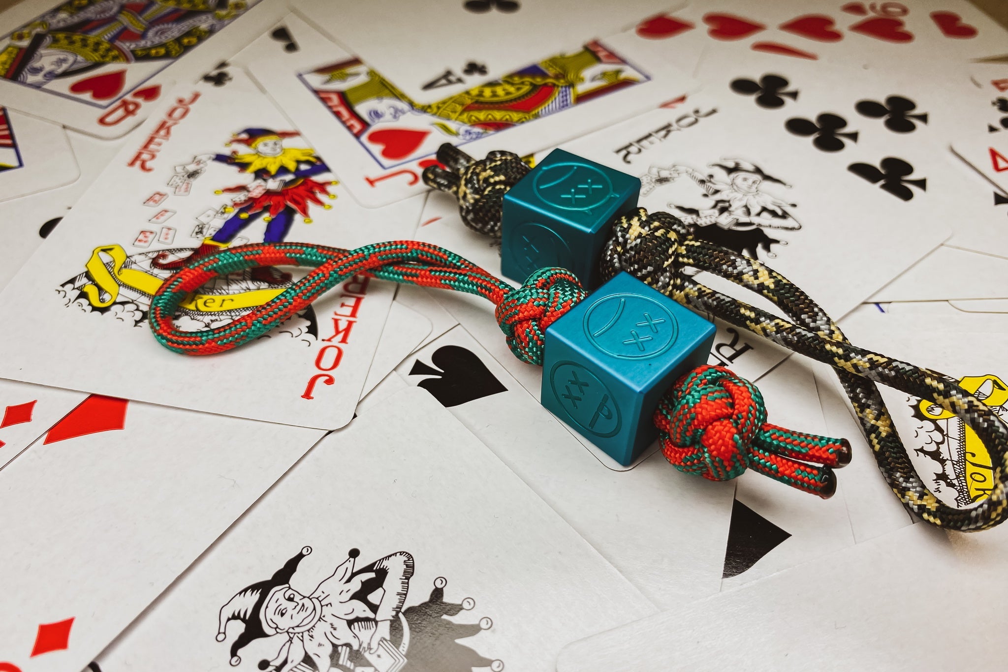 Macro shot of the non-reflective Type II matte teal finish on a custom aluminum bead.