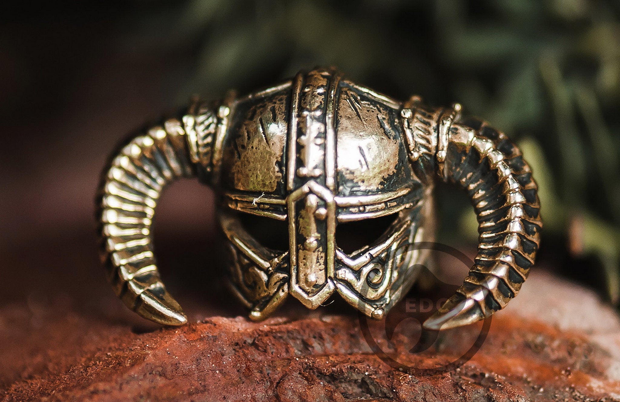 Hand-casted brass lanyard bead shaped like a horned Nordic Dragon Slayer helmet.