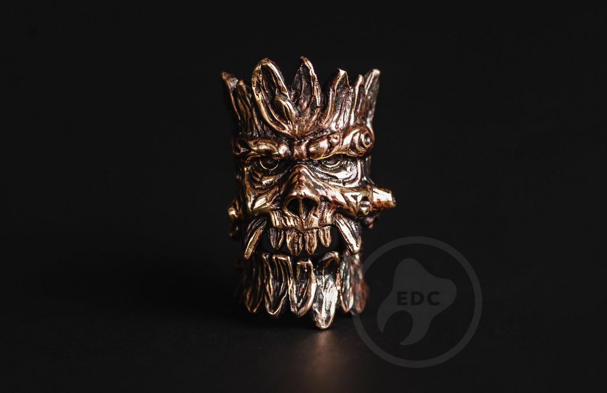 Profile view of the bearded forest spirit bead with antique blackened finish.