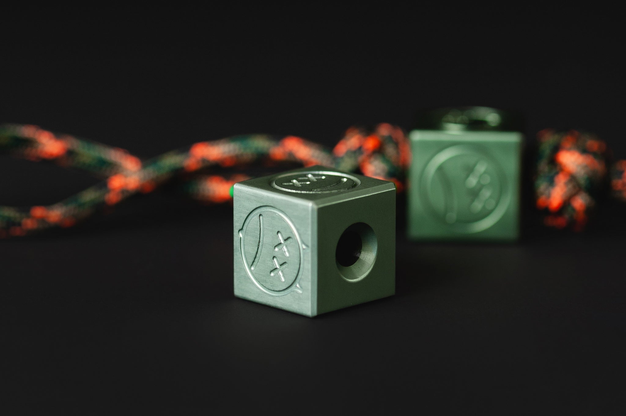 Close-up of the earthy olive metallic finish on a custom aluminum bead.