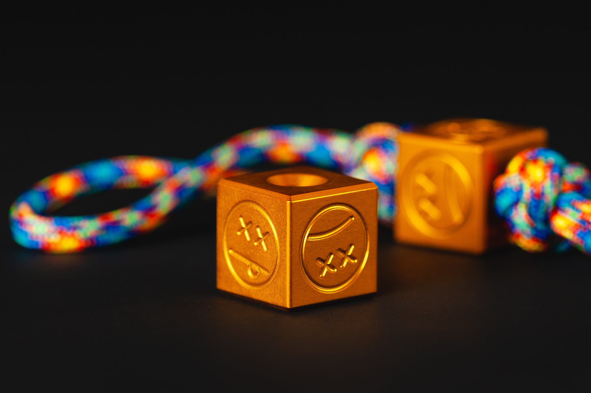 Vibrant orange Type II anodized aluminum Sad Face Cube bead.