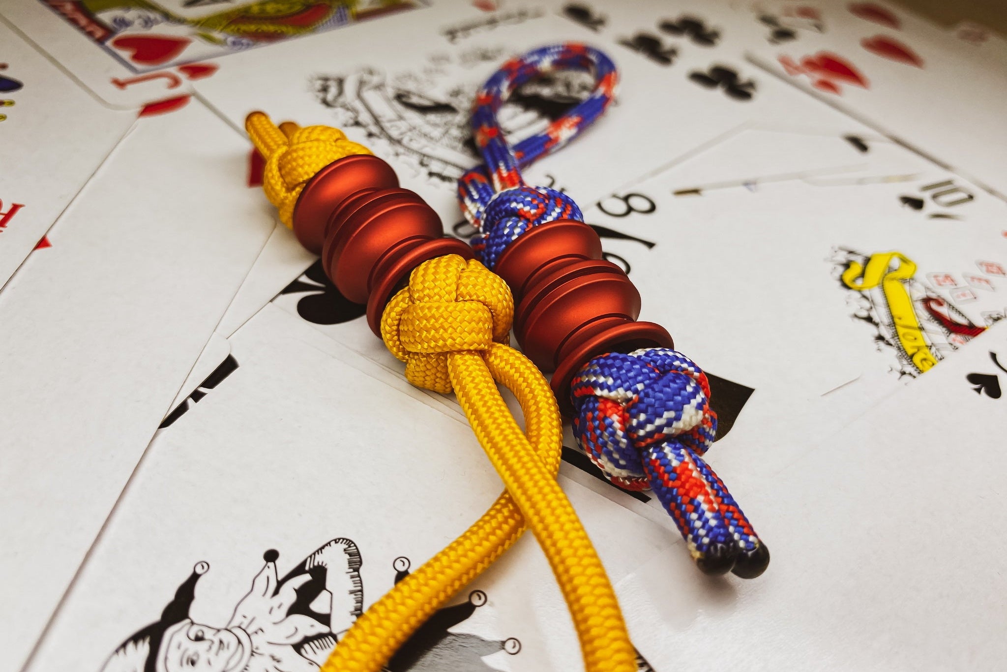Red Grooved Barrel EDC bead showing the 6mm hole for 550 paracord attachment.