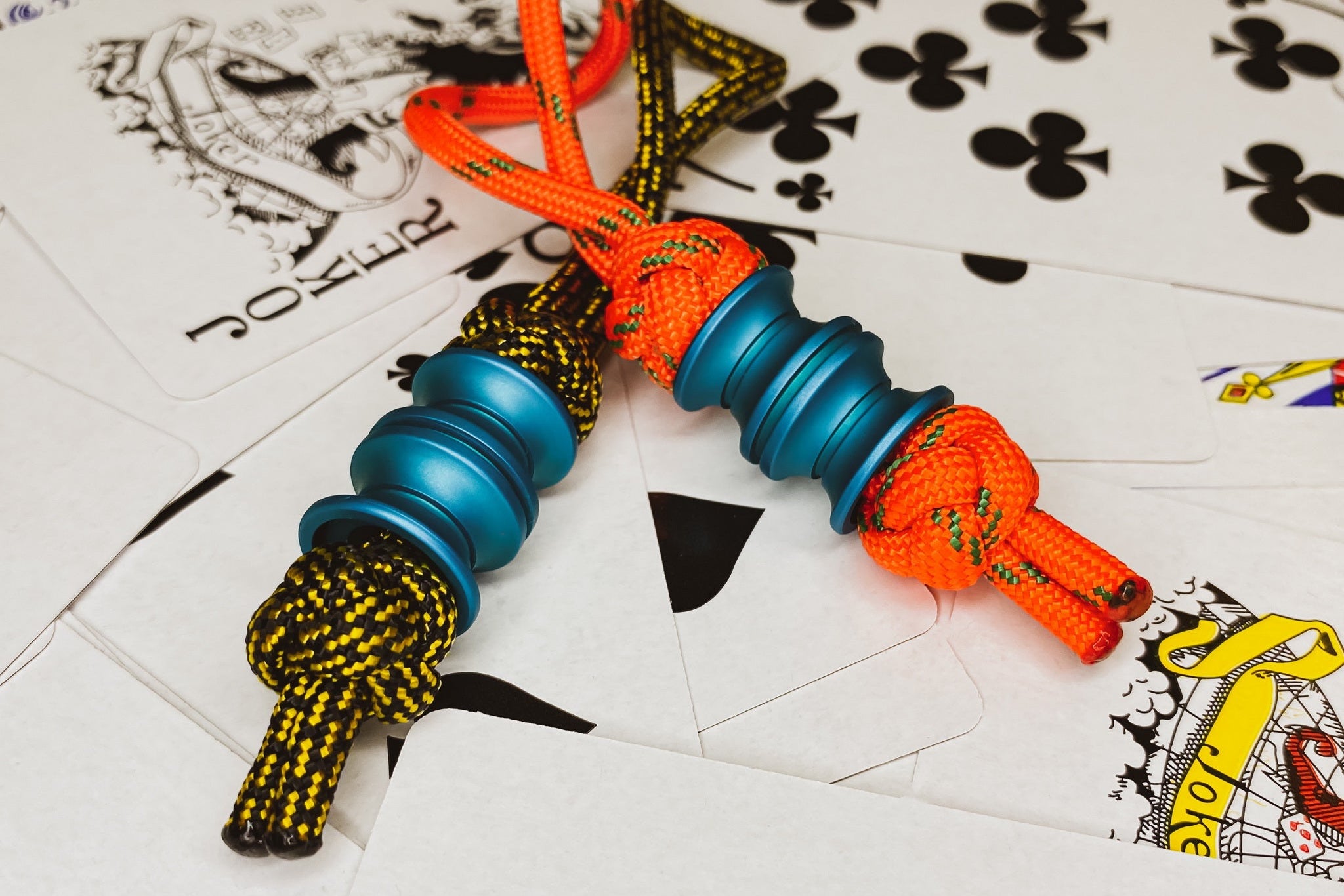 Macro shot of the matte teal finish and precision grooves on a metal bead.