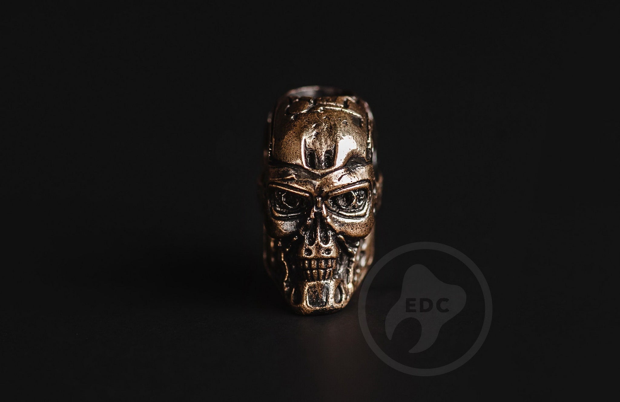 Ultra-slim Terminator brass bead on a lightweight folding knife lanyard.