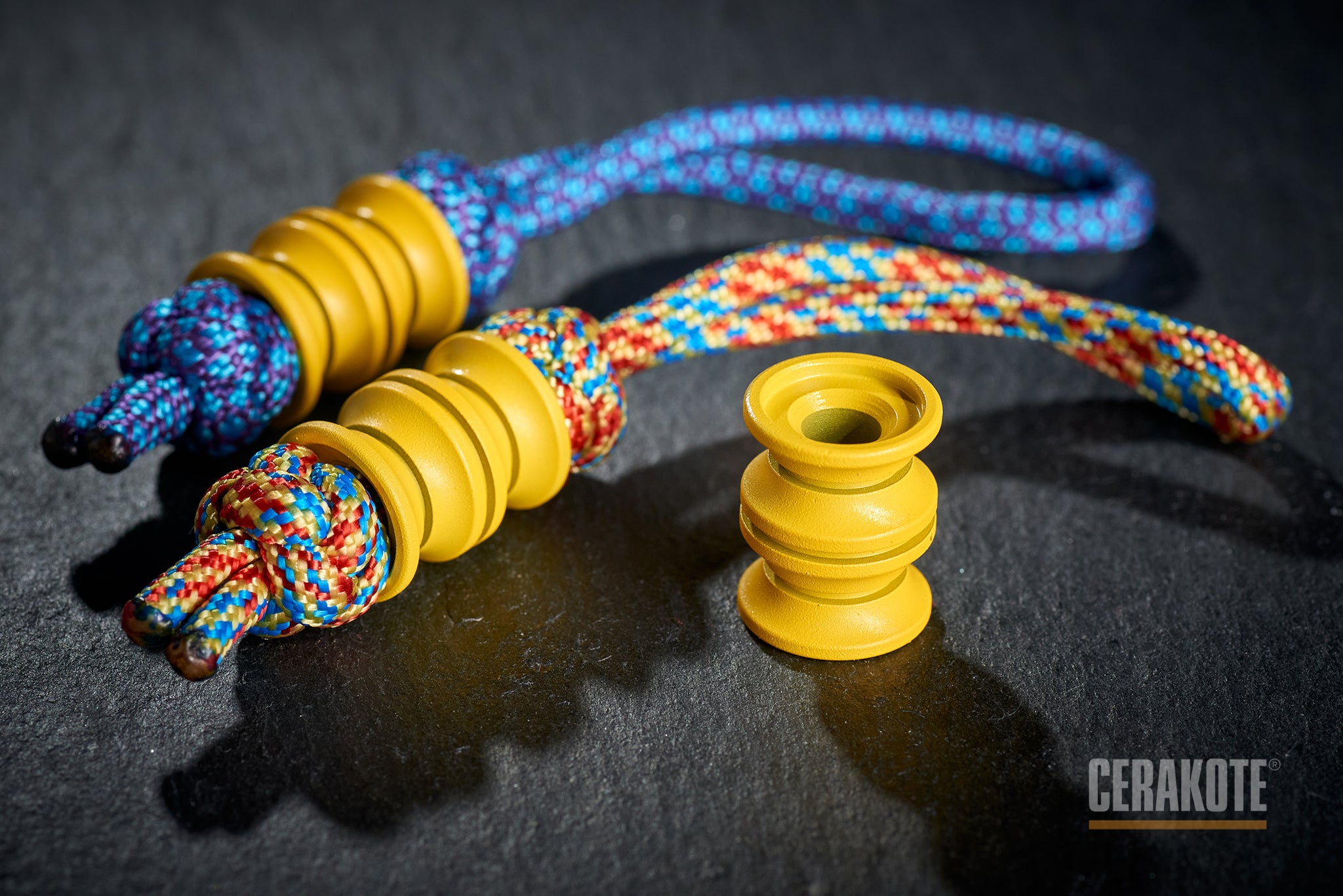 Ribbed texture of Corvette Yellow Cerakote on a titanium bead.-1