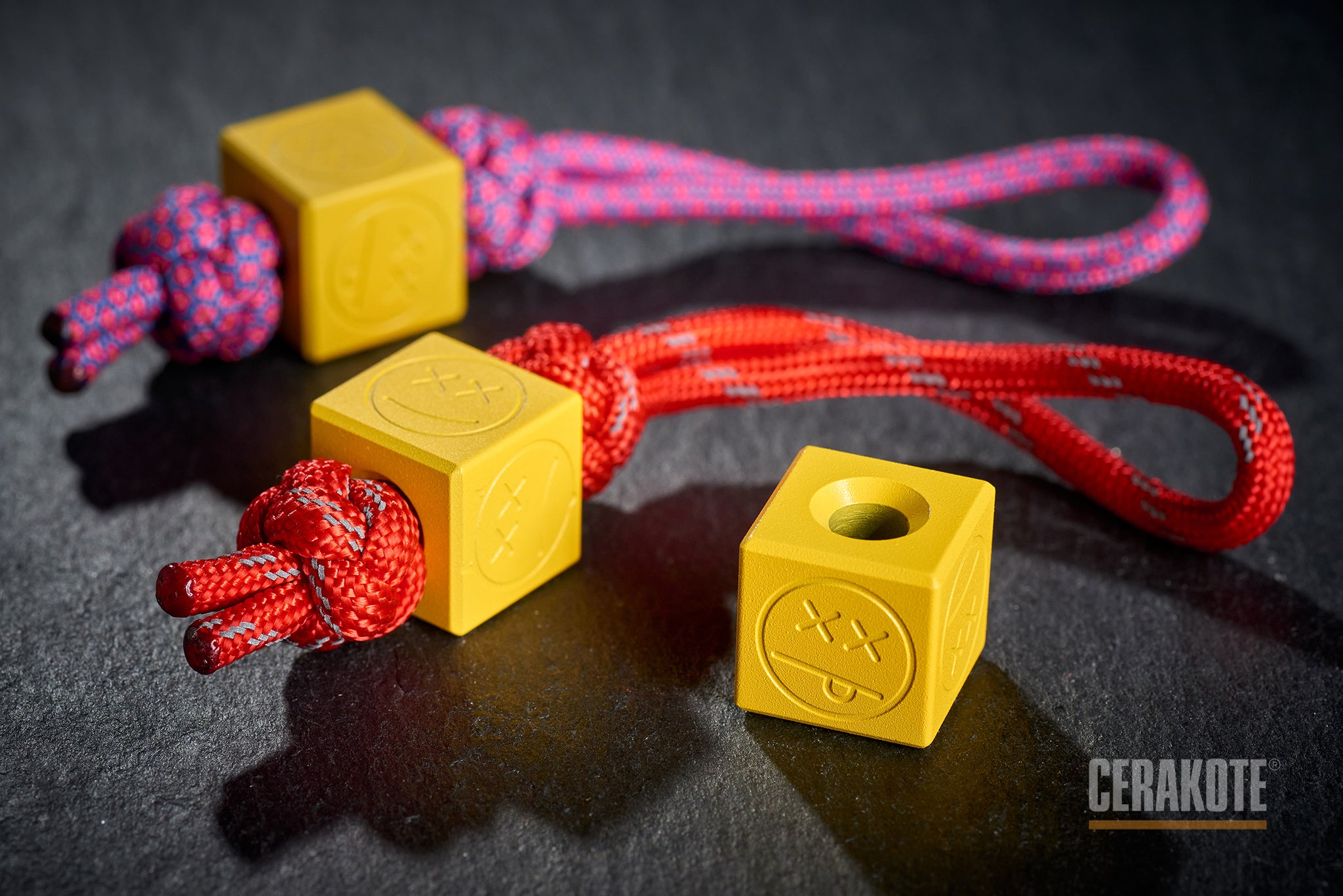 Close-up of Corvette Yellow Cerakote finish on a titanium cube.-1