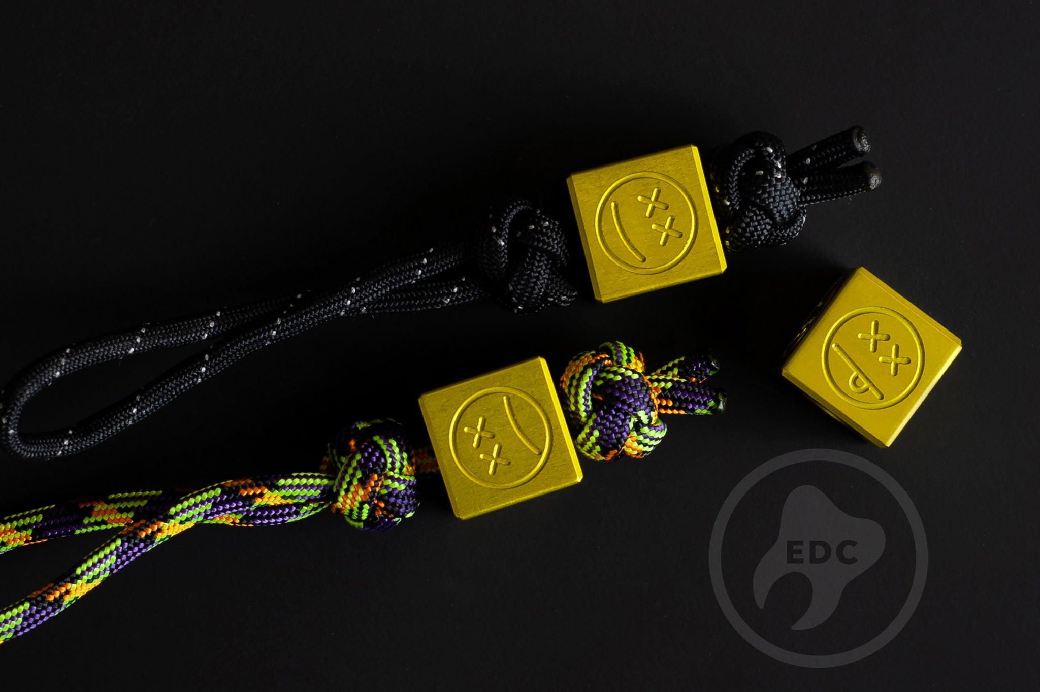 Yellow aluminum Sad Face bead displaying the top hole for 550 paracord.