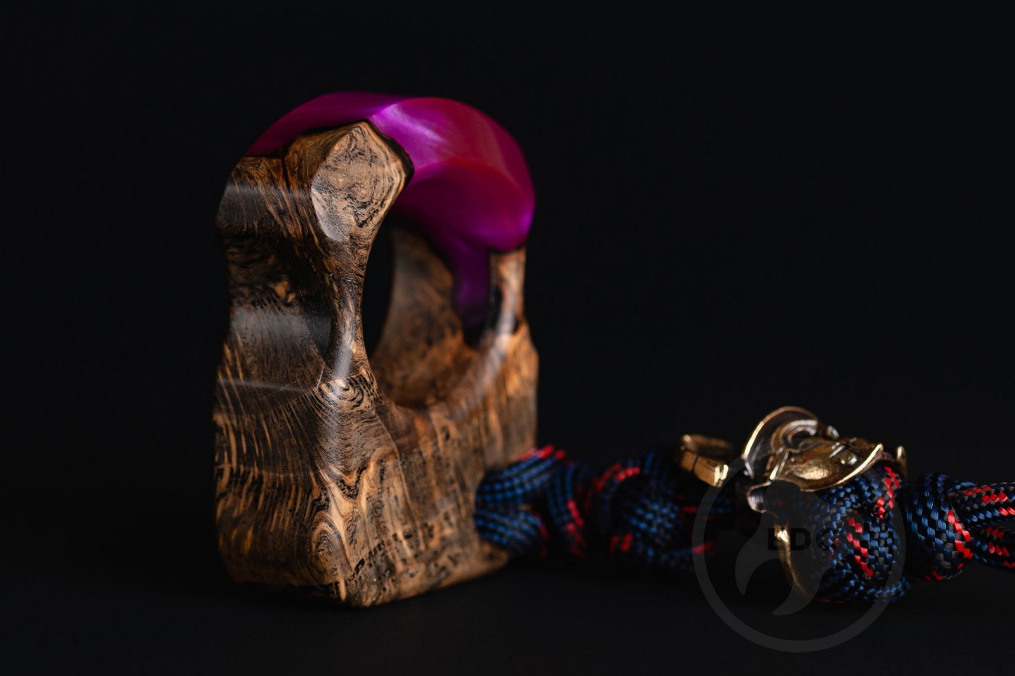 Close up of solid brass Roman Centurion helmet bead on purple lanyard, Texture detail of purple resin and oak wood pocket art-2