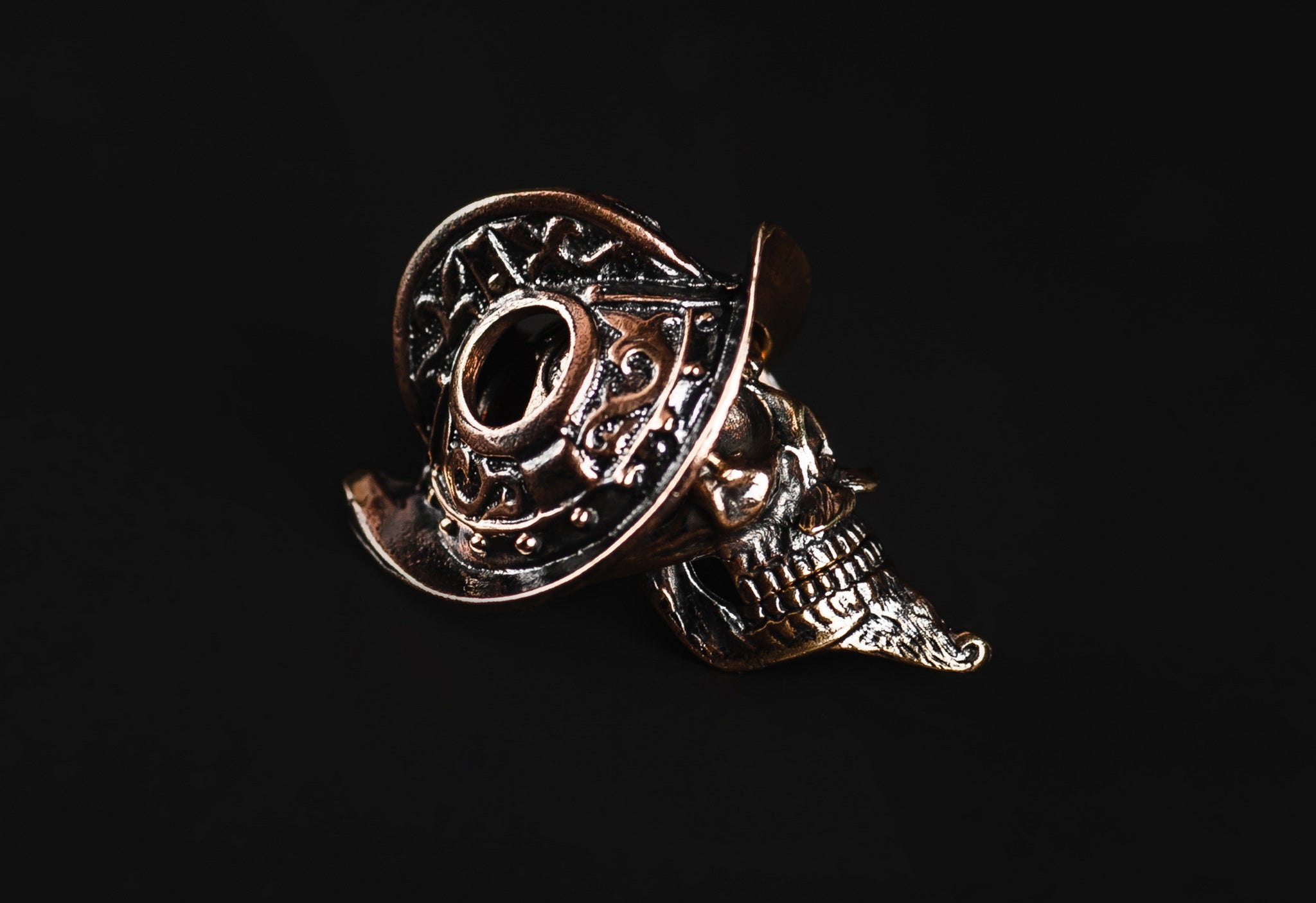 Close-up of the rivets and crest on the Conquistador Morion helmet brass bead.-1