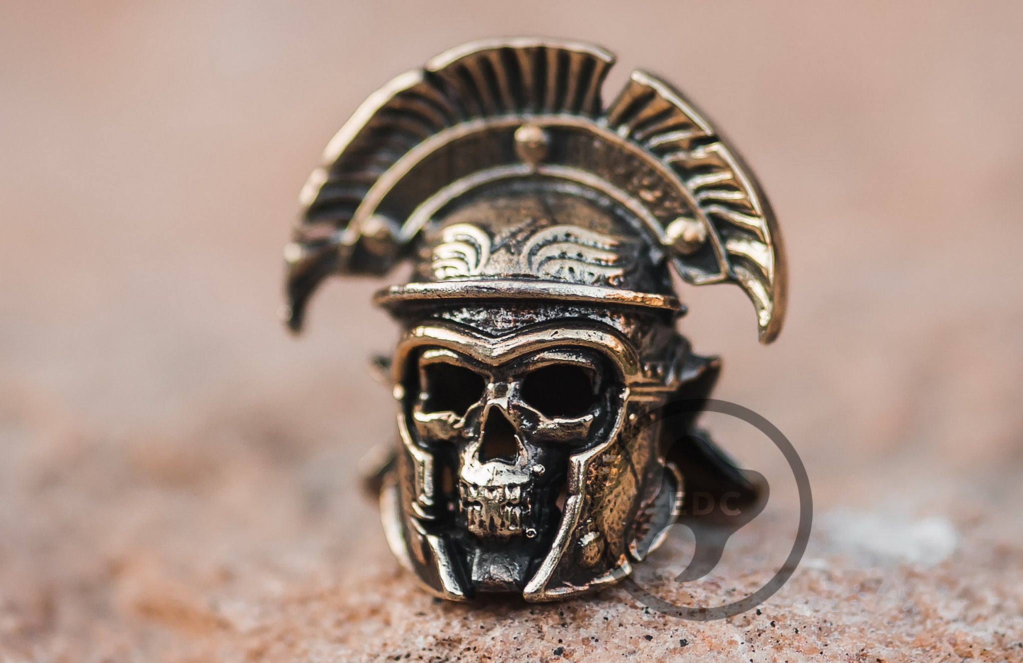 Brass skull bead wearing a Roman Centurion helmet for paracord lanyards.