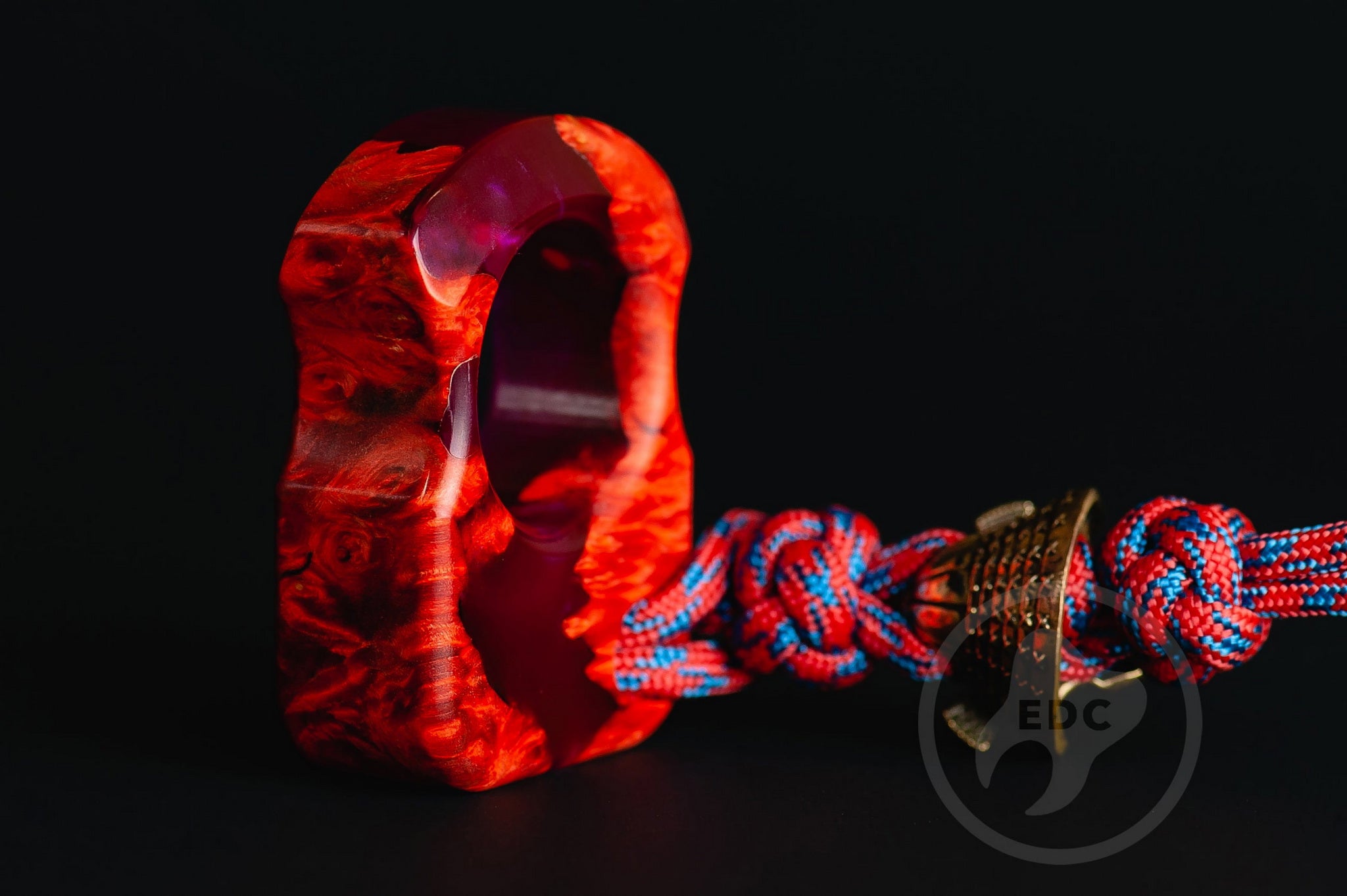 Close up of solid brass Samurai Kabuto helmet bead on lanyard, Texture detail of maple burl wood and purple resin pocket sculpture-2