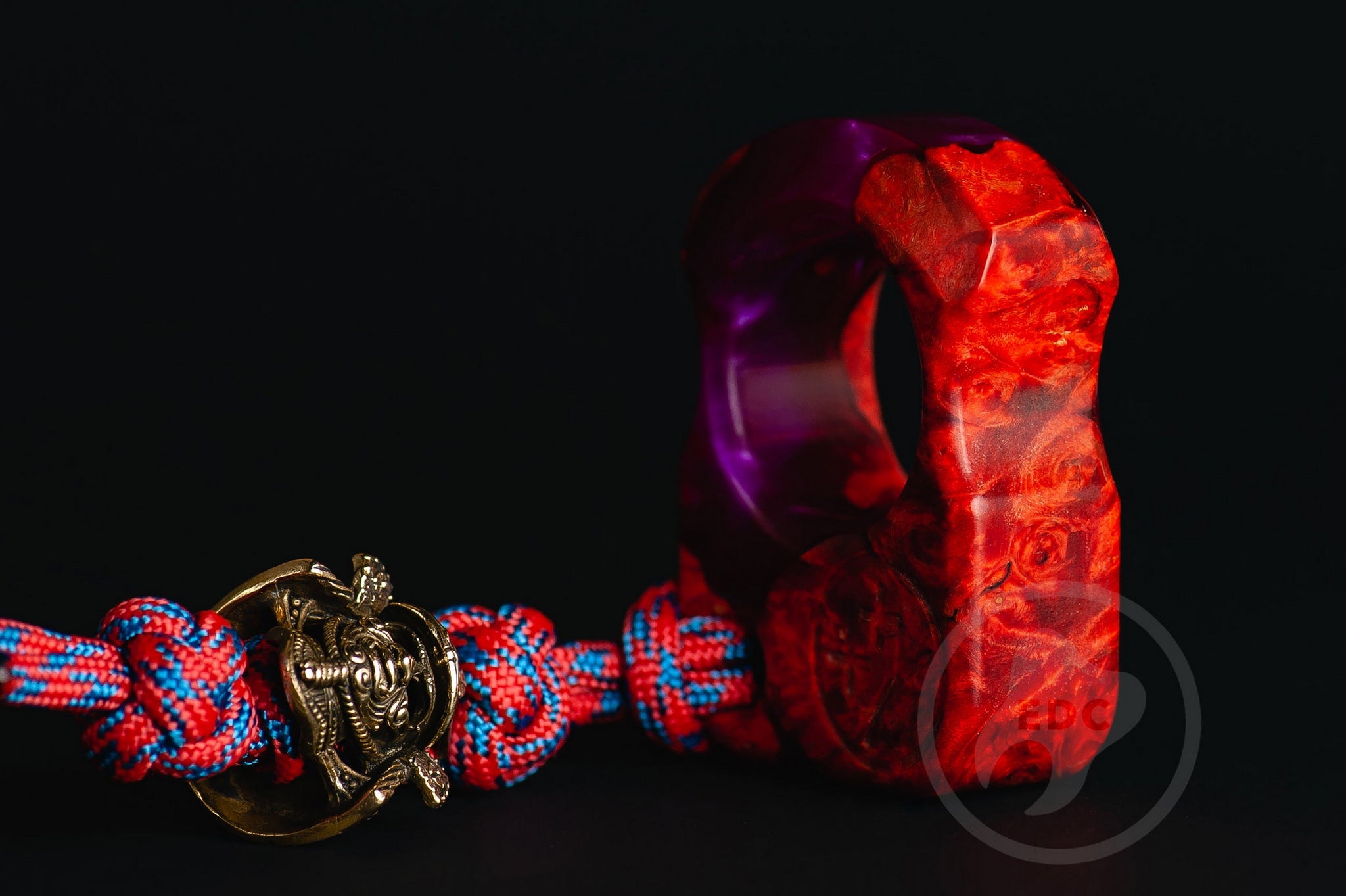 Close up of solid brass Samurai Kabuto helmet bead on lanyard, Texture detail of maple burl wood and purple resin pocket sculpture-3