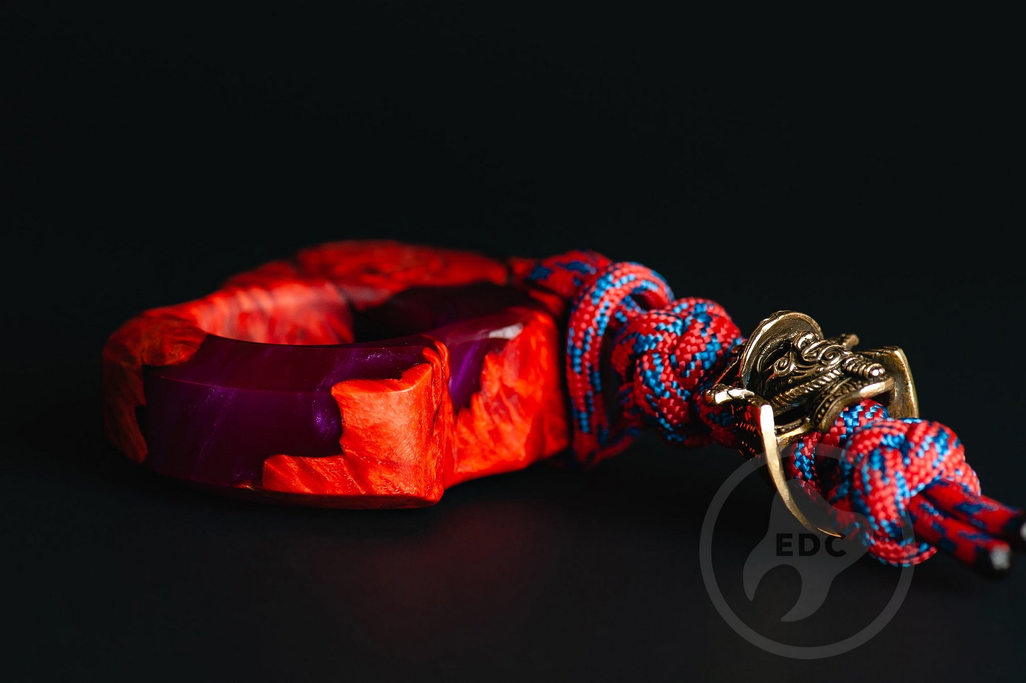 Close up of solid brass Samurai Kabuto helmet bead on lanyard, Texture detail of maple burl wood and purple resin pocket sculpture-4