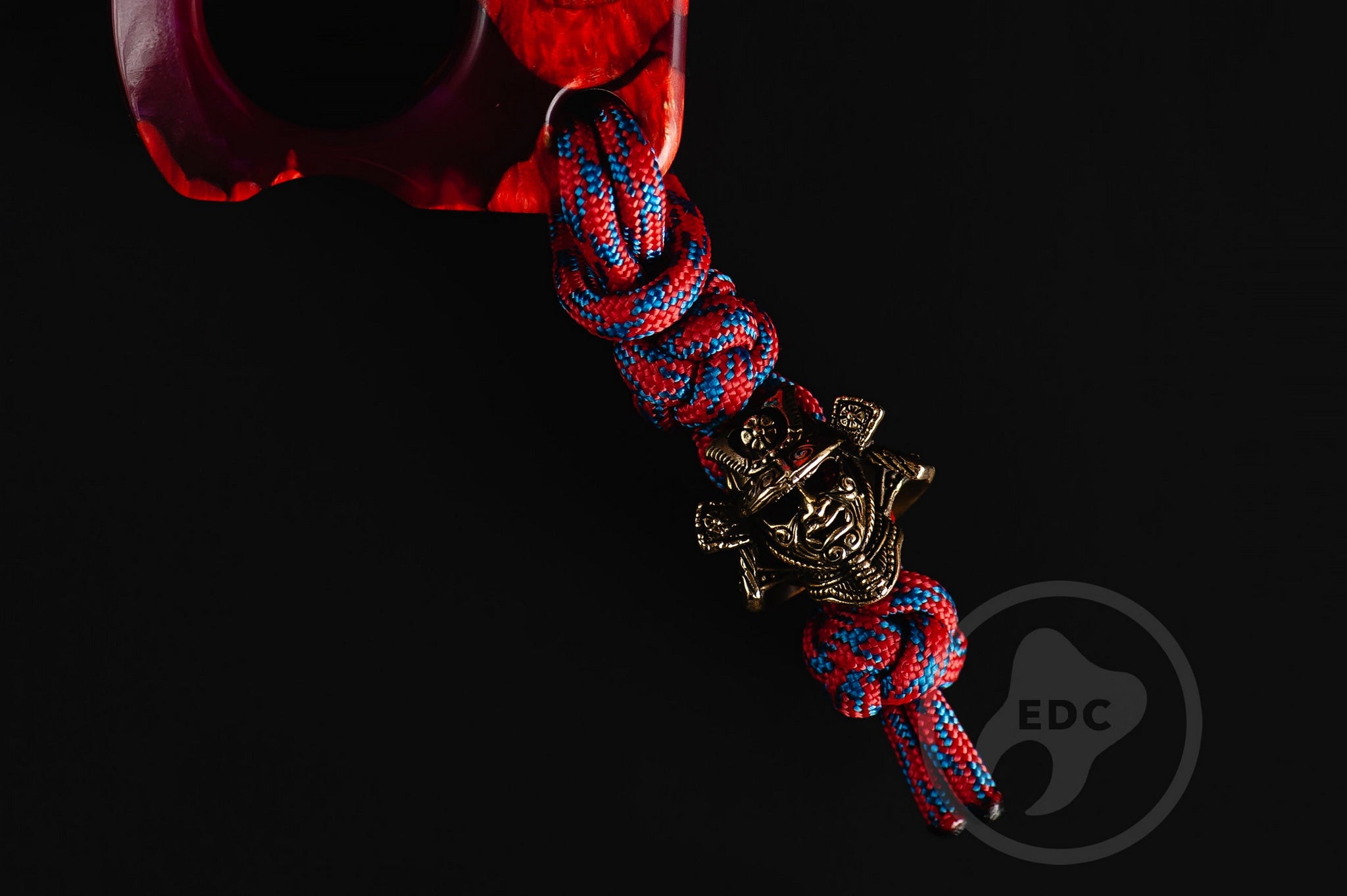 Close up of solid brass Samurai Kabuto helmet bead on lanyard, Texture detail of maple burl wood and purple resin pocket sculpture-5