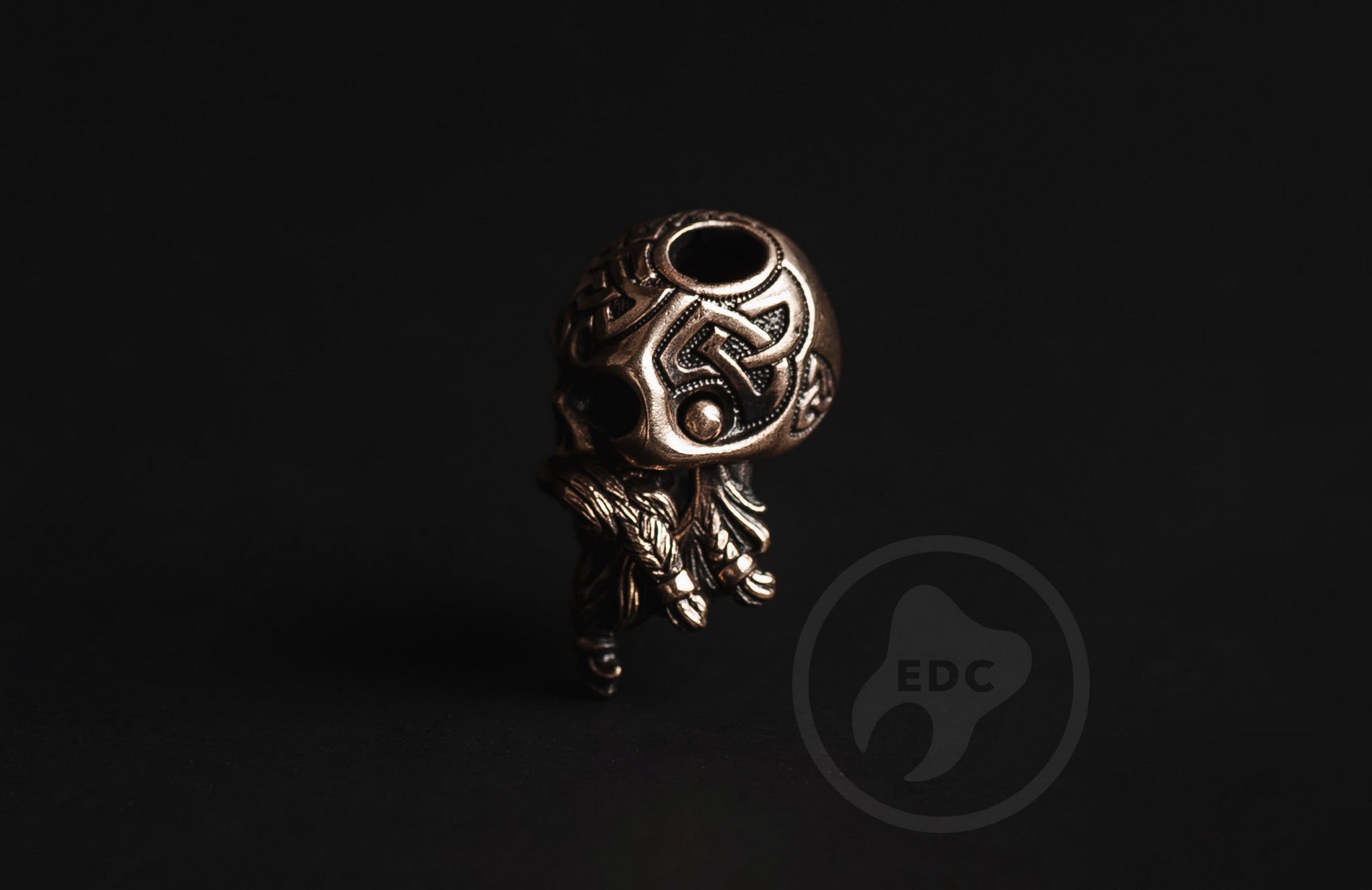 Close-up of the intricate Celtic knot pattern on the brass skull.-2