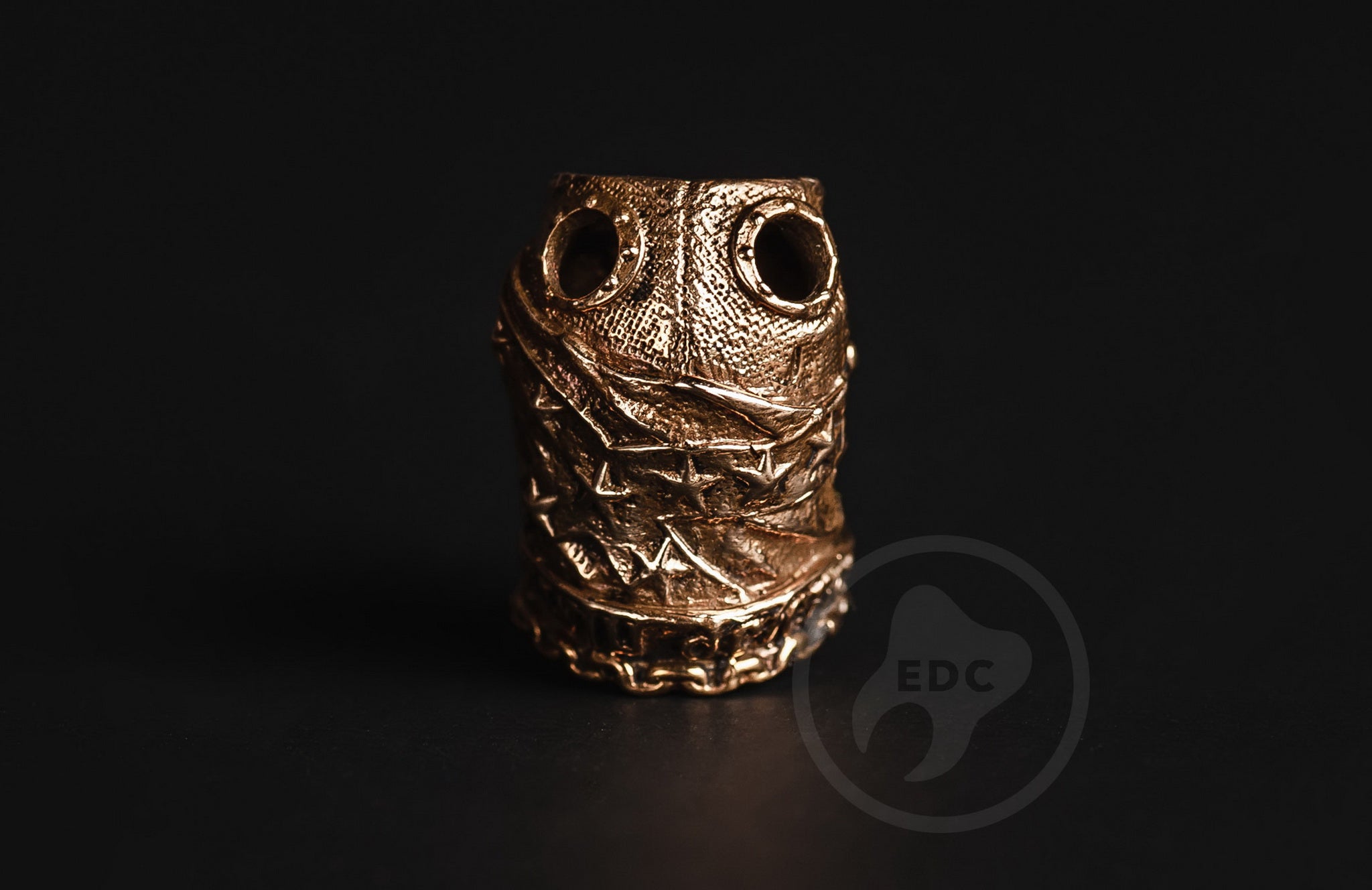Bottom view showing the large 12mm knot-hider cavity on the brass soldier bead.-1