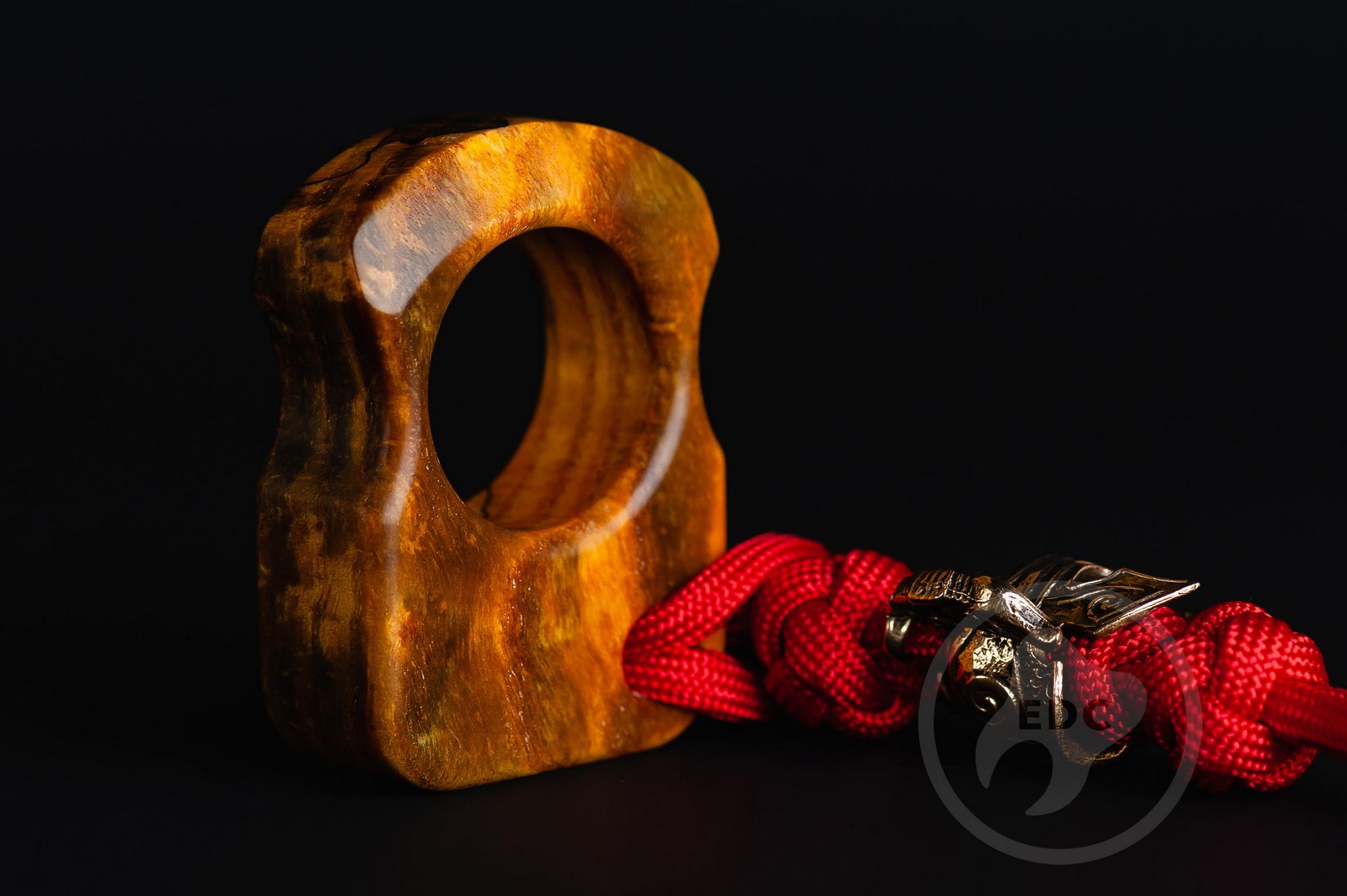 Close up of solid brass Spartan helmet bead on lanyard, Texture detail of curly ash burl pocket sculpture-3