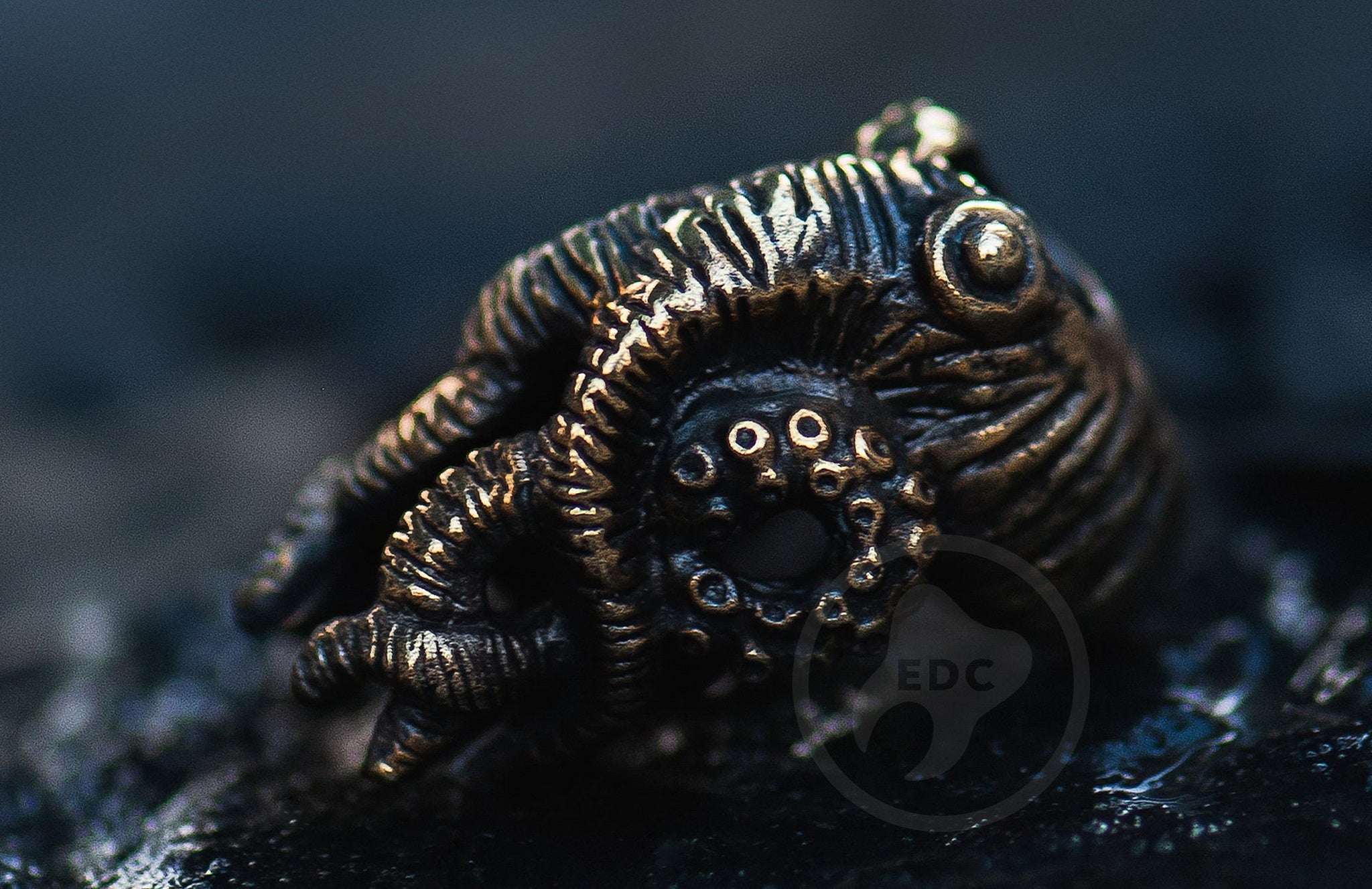 Hand-casted brass lanyard bead shaped like a Deep Sea Kraken Octopus.