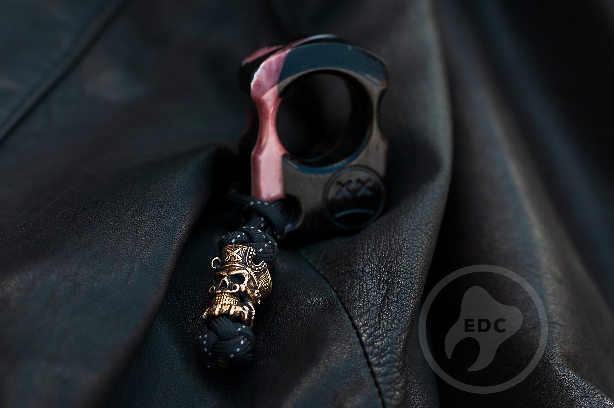 Close up of solid brass pirate skull bead on Series S01 lanyard, Back view of milk white resin and ironwood pocket sculpture