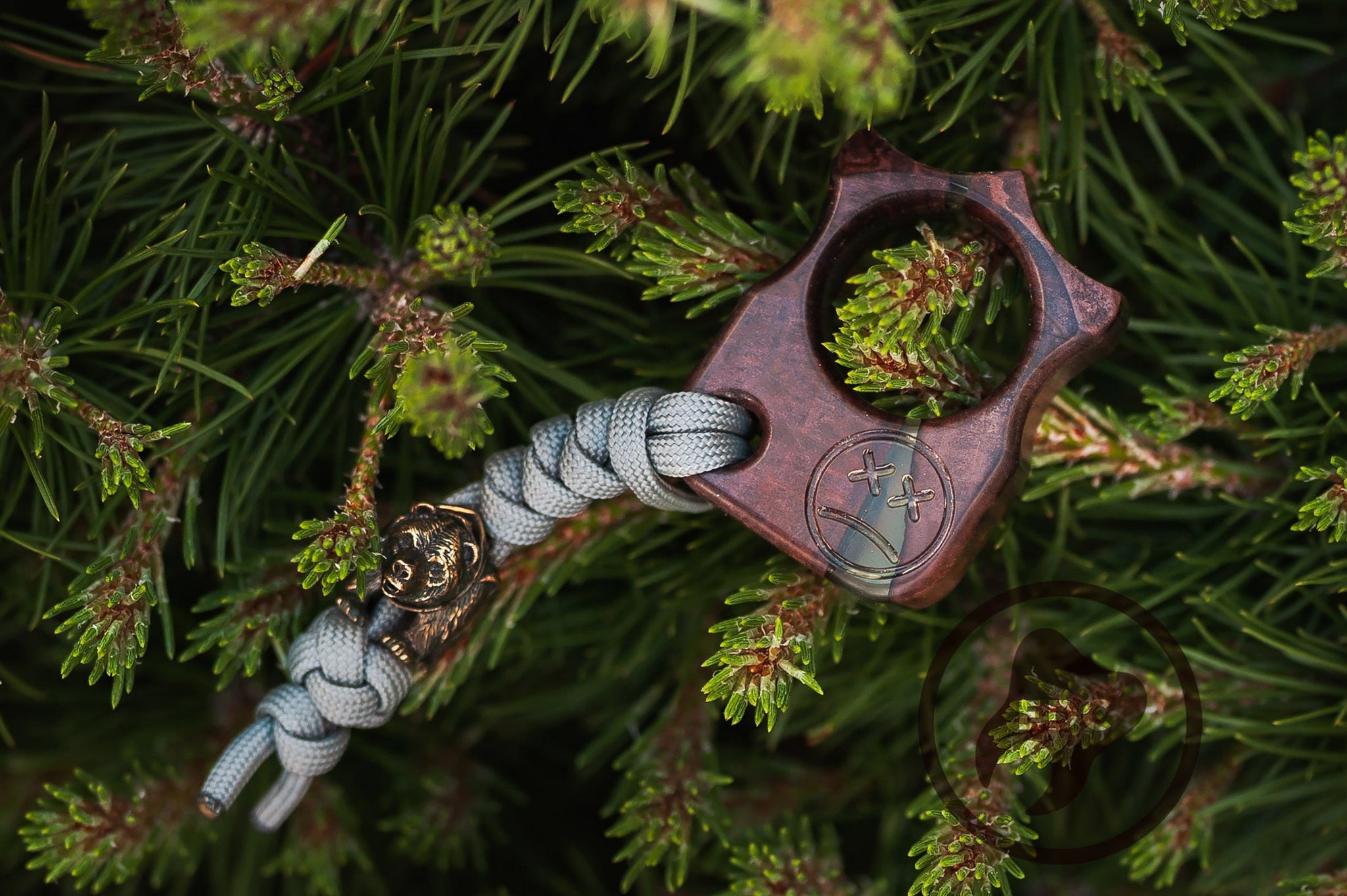 Close up of solid brass Fighting Bear bead on blue lanyard, Ergonomic shape of Series S03 pocket tool in wood and resin-2