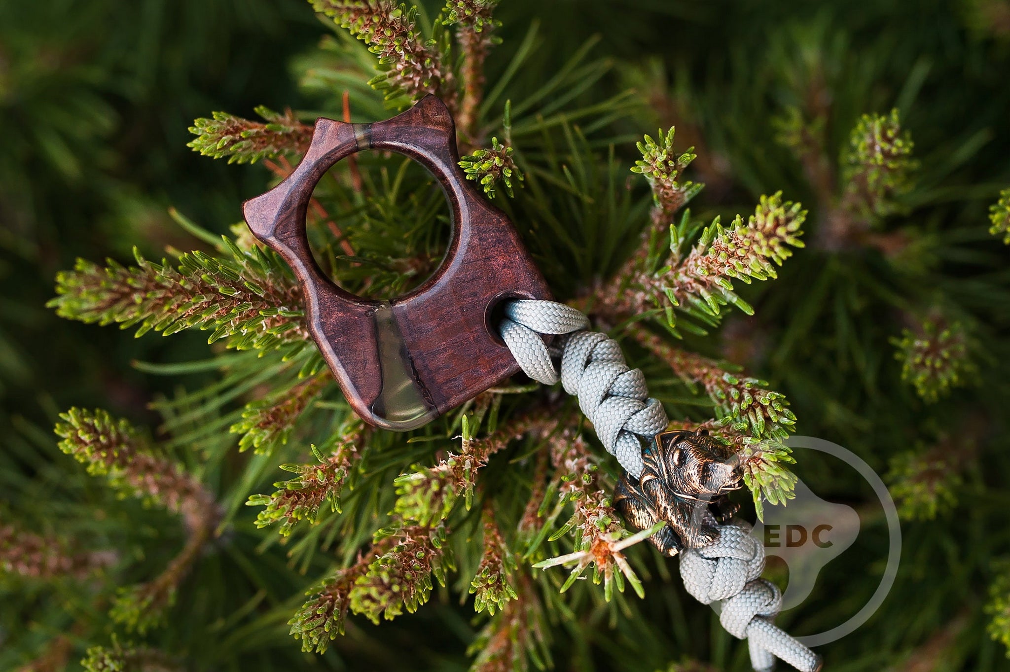 Close up of solid brass Fighting Bear bead on blue lanyard, Ergonomic shape of Series S03 pocket tool in wood and resin-3
