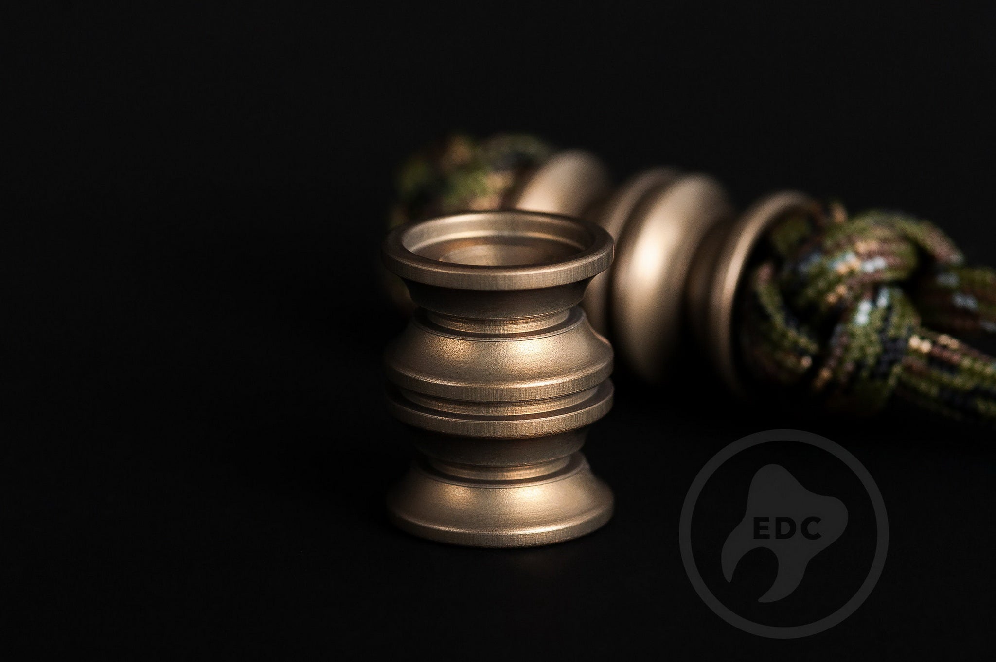 Professional industrial-grade lanyard bead in matte grey hardcoat anodized aluminum.