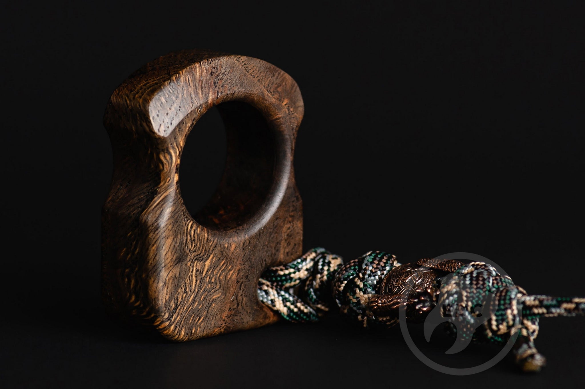 Close up of solid brass Viking King Ragnar bead on lanyard, Texture detail of natural oak burl pocket art-2