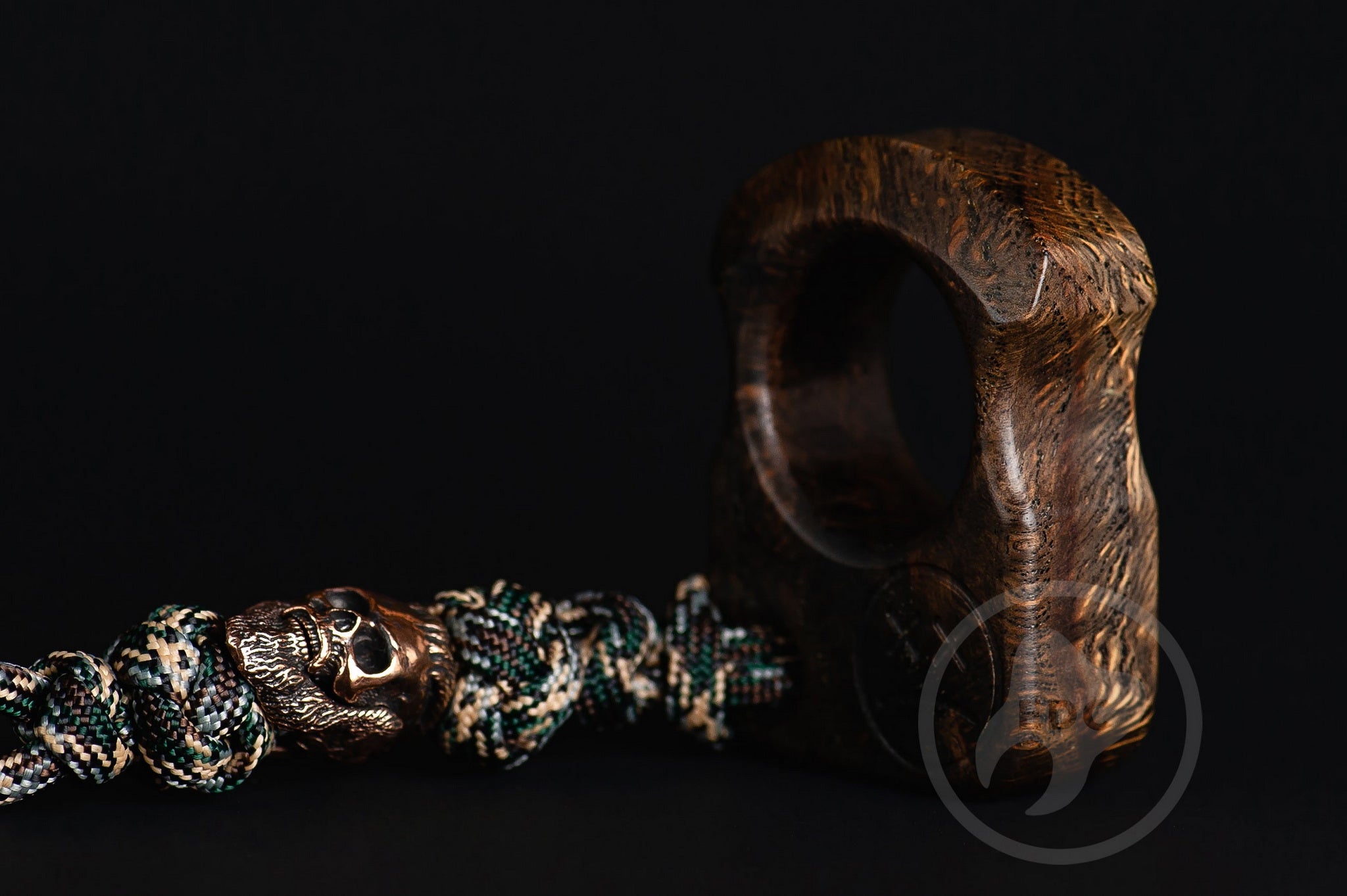 Close up of solid brass Viking King Ragnar bead on lanyard, Texture detail of natural oak burl pocket art-3