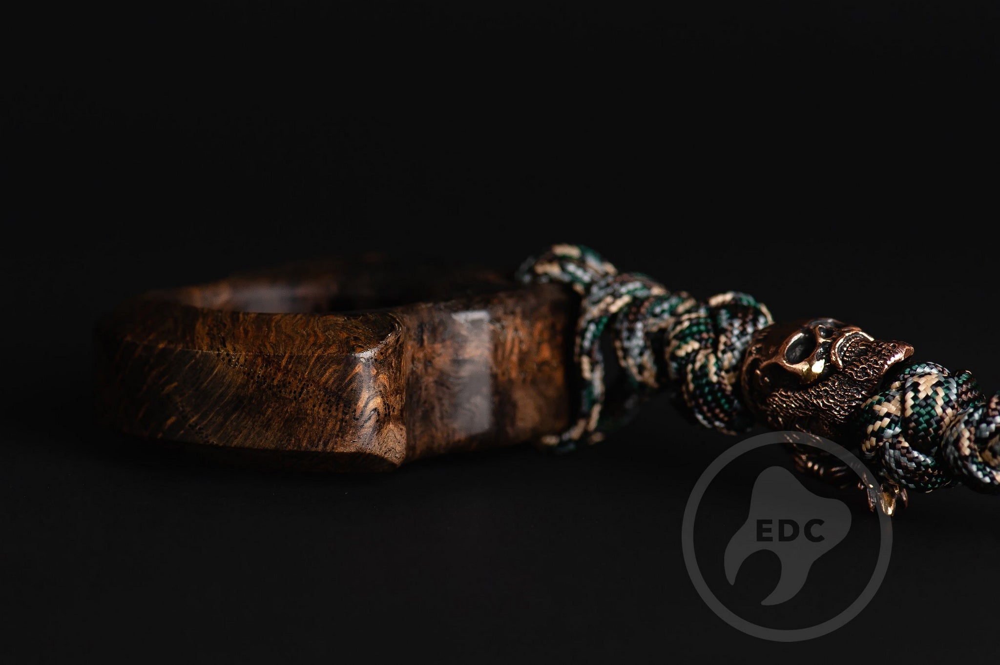 Close up of solid brass Viking King Ragnar bead on lanyard, Texture detail of natural oak burl pocket art-4