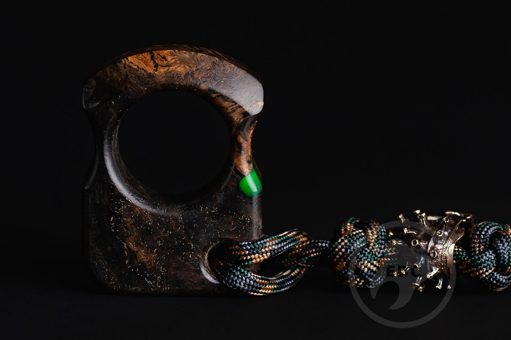 Close up of solid brass Covid-19 bead on green lanyard, Texture detail of oak burl and green resin pocket sculpture-2