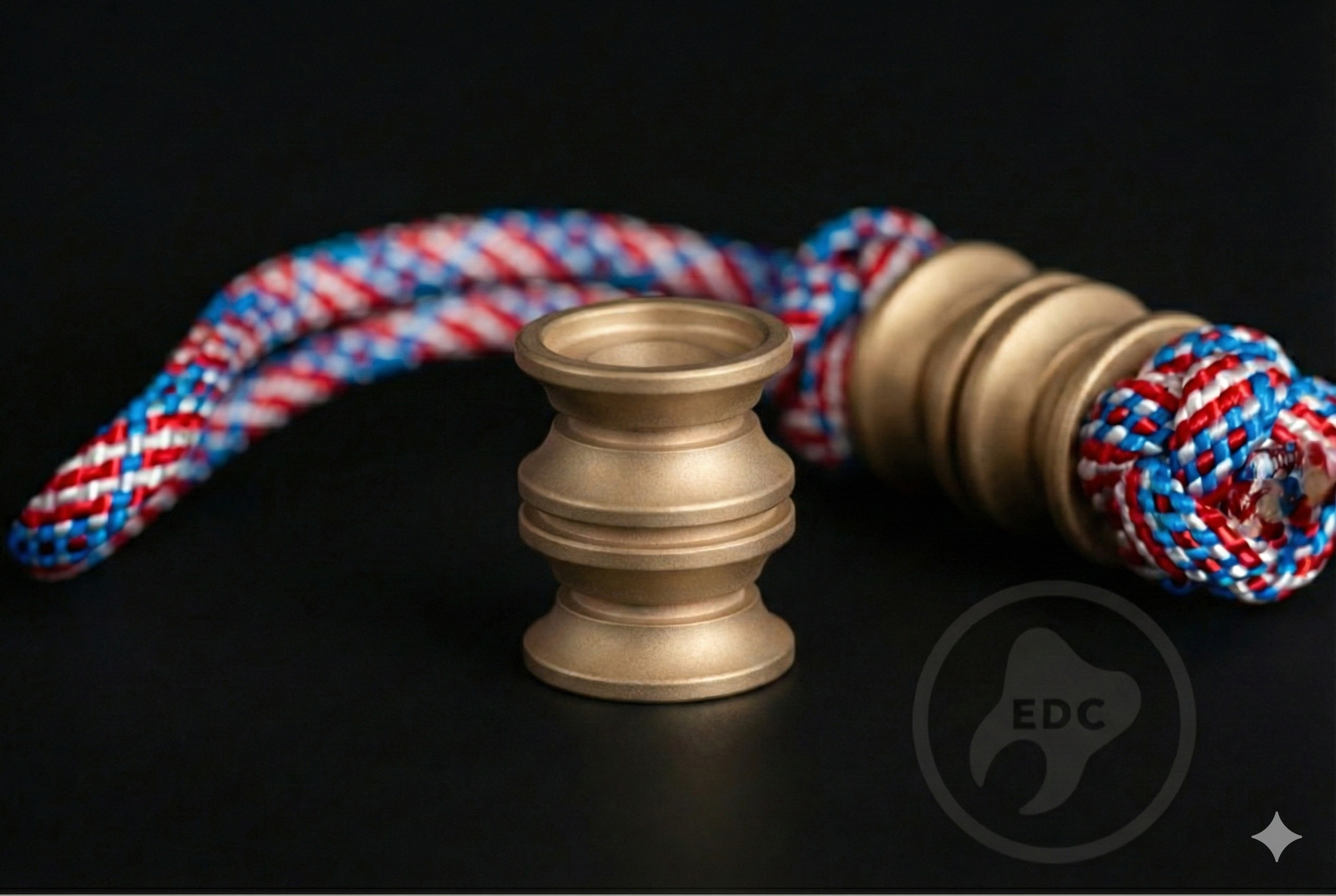 Matte brass cylinder bead with 6mm hole on a stonewashed knife lanyard.