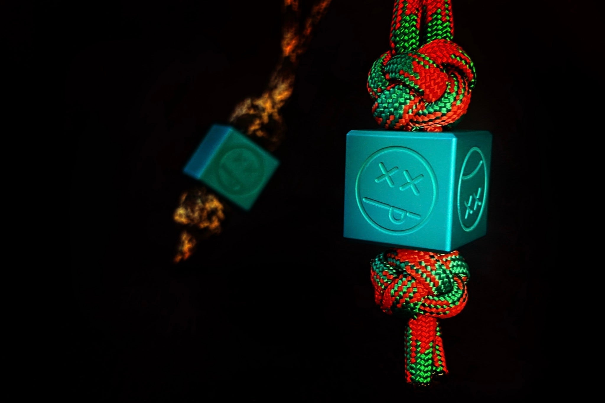 Macro shot of the non-reflective Type II matte teal finish on a custom aluminum bead.-1