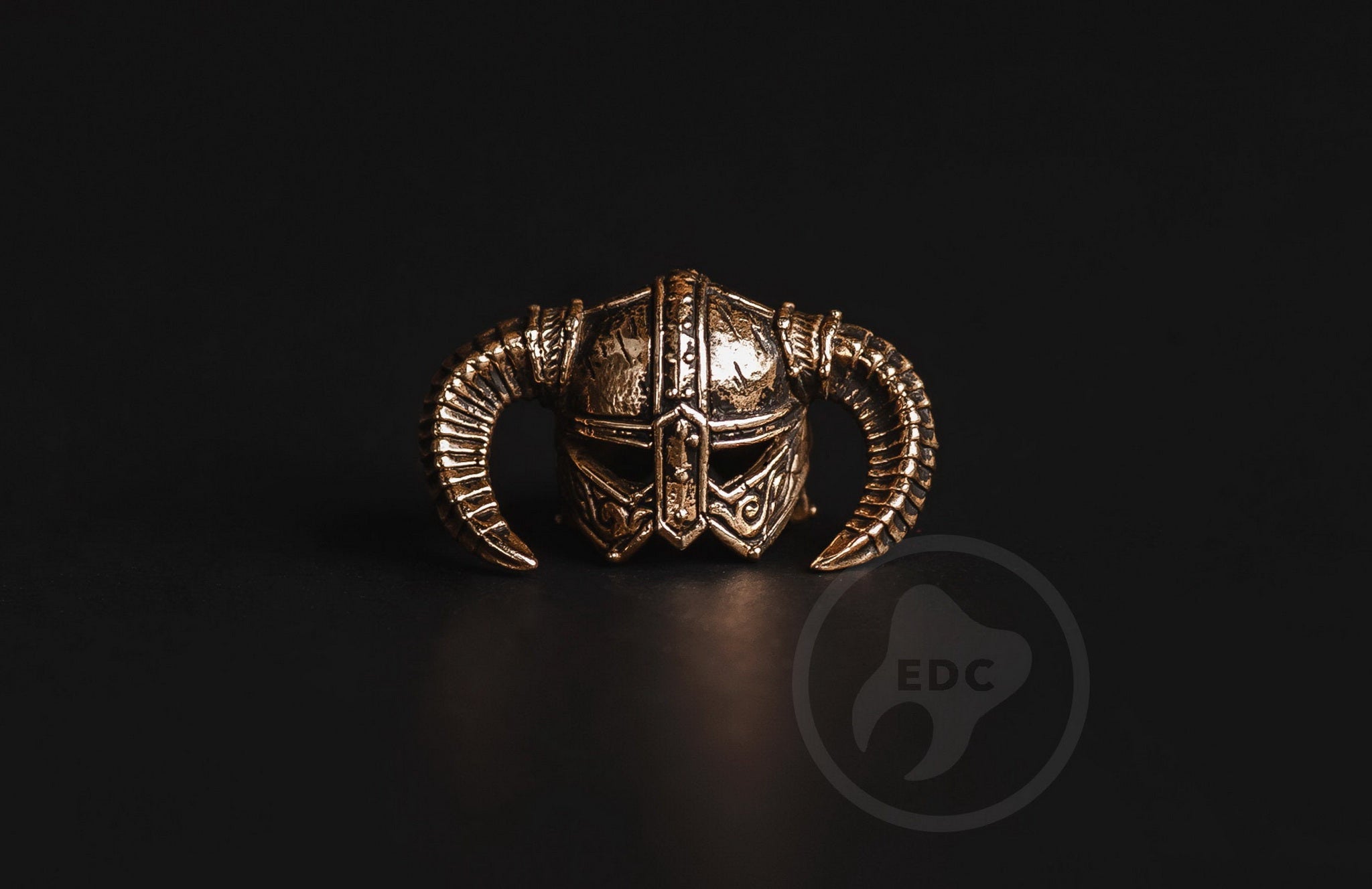Hand-casted brass lanyard bead shaped like a horned Nordic Dragon Slayer helmet.-1