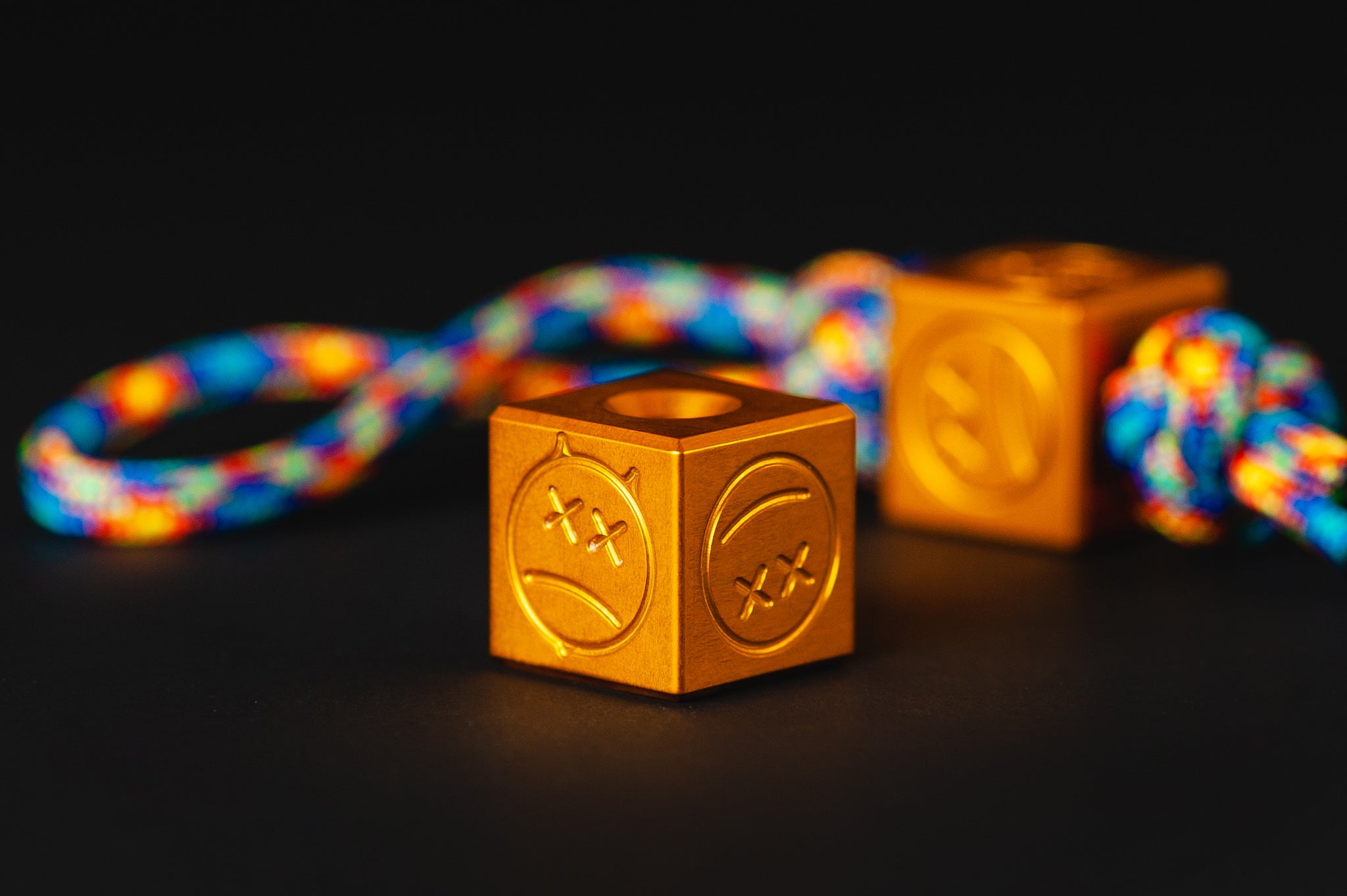 Macro shot of the bright orange metallic finish on a custom aluminum bead.