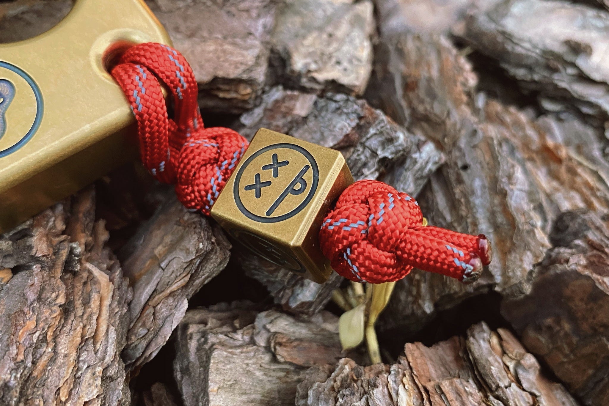 Close-up of the antique patina and engraved sad expression on the brass bead.-2