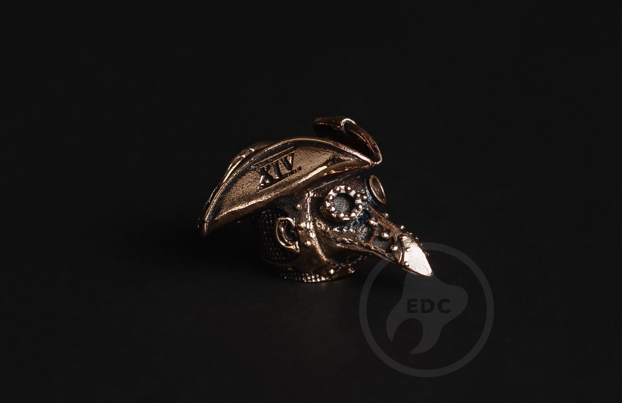 Detail of the XIV Roman numeral on the Plague Doctor hat brass bead.-1