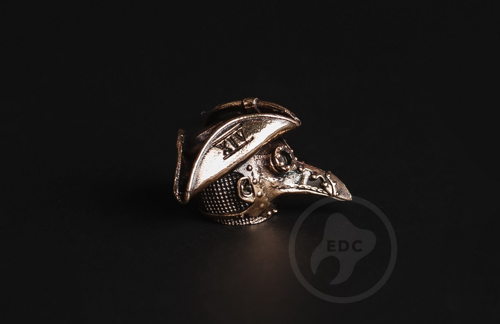Detail of the XIV Roman numeral on the Plague Doctor hat brass bead.-2