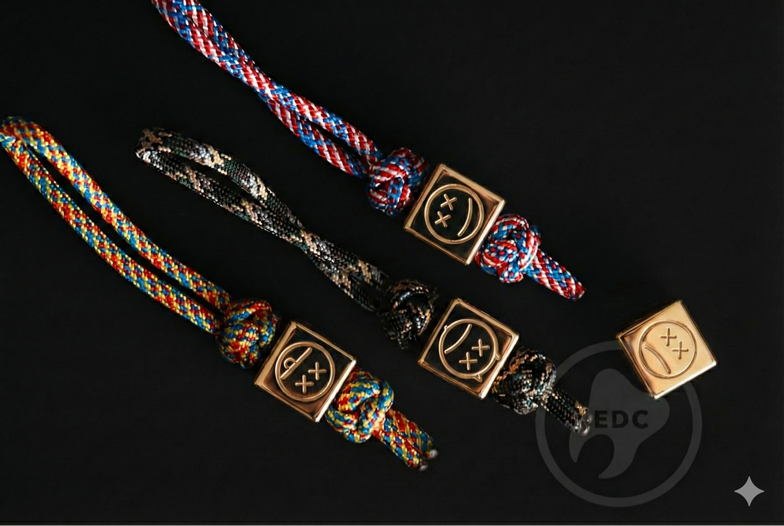 Shiny 40g brass cube attached to a folding knife lanyard.-1