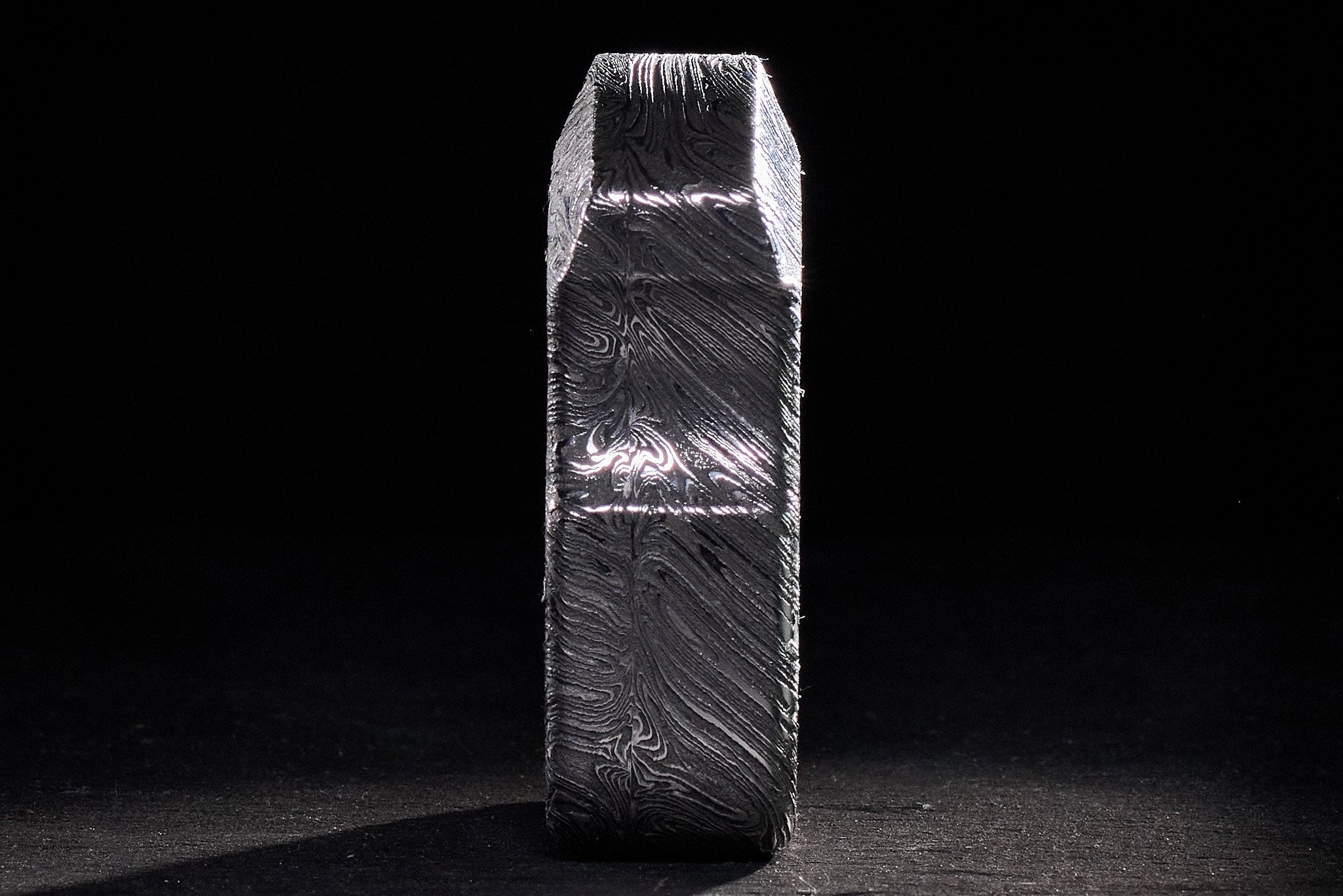 Top-down view of the high-carbon forged Damascus steel grain and texture.