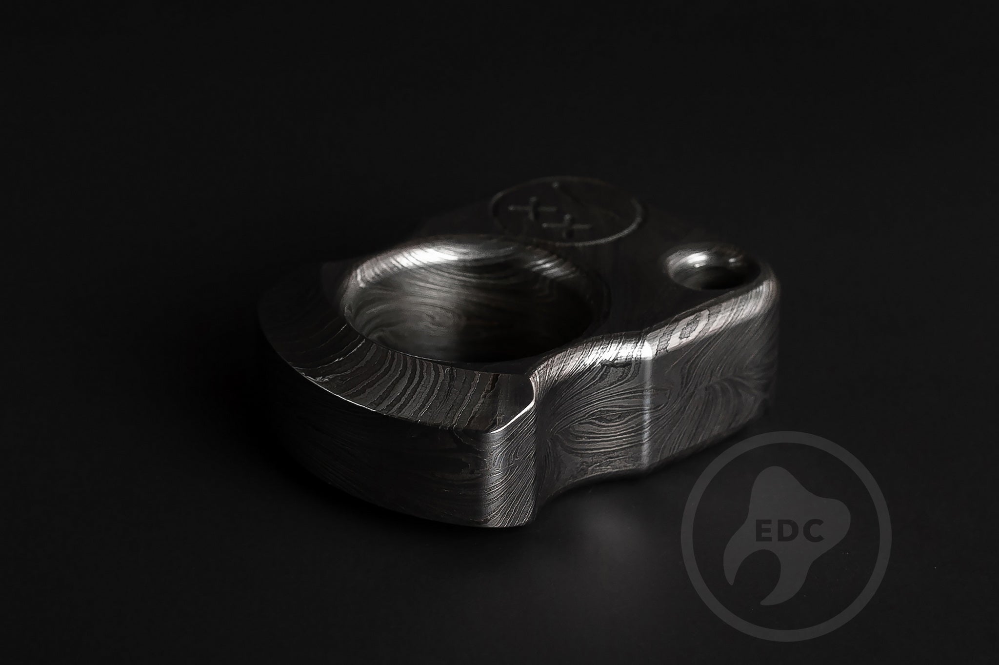 Detailed view of hand-polished and acid-etched Damascus steel texture-2